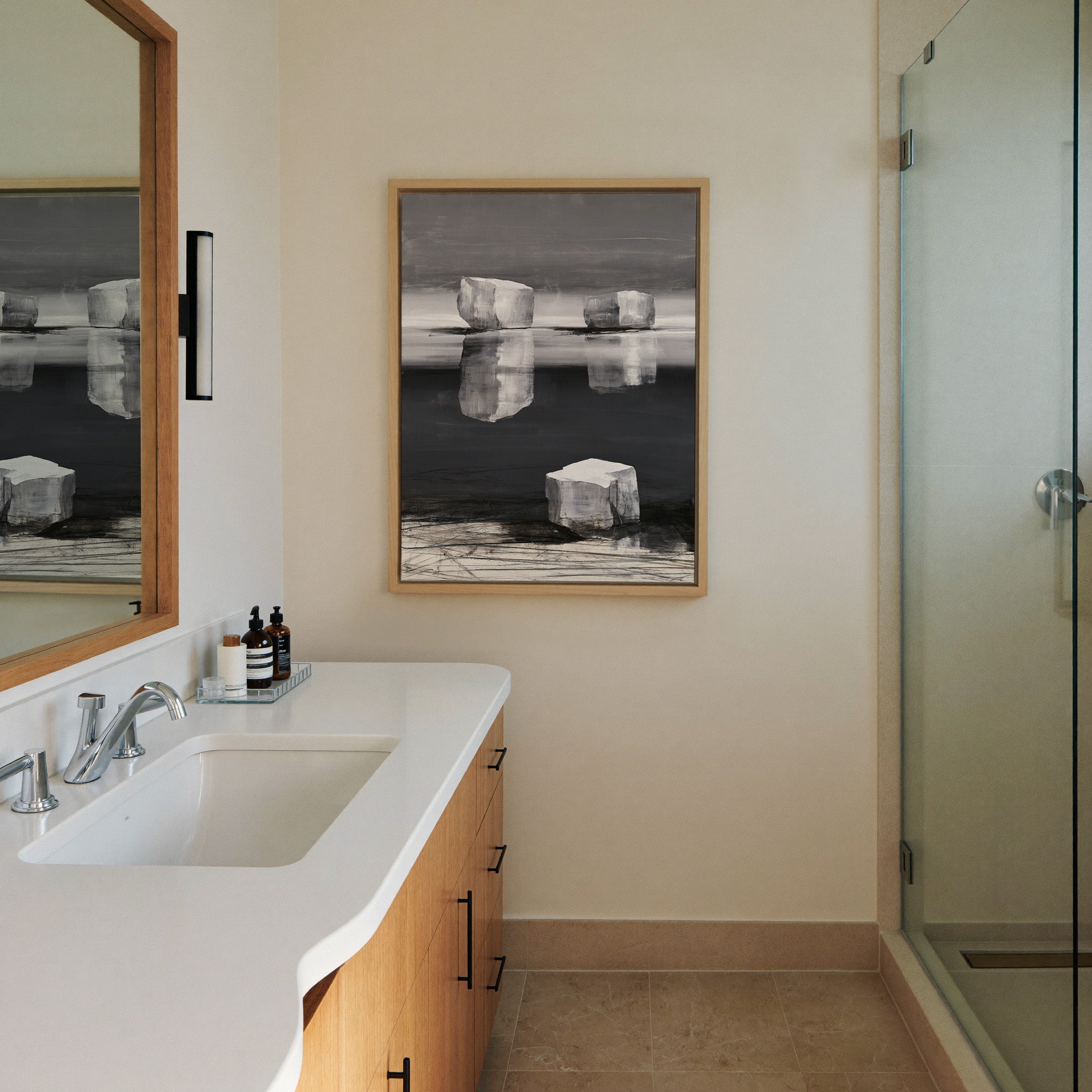 monochrome abstract with pale canvas wall art in a natural wood frame in a styled room setting