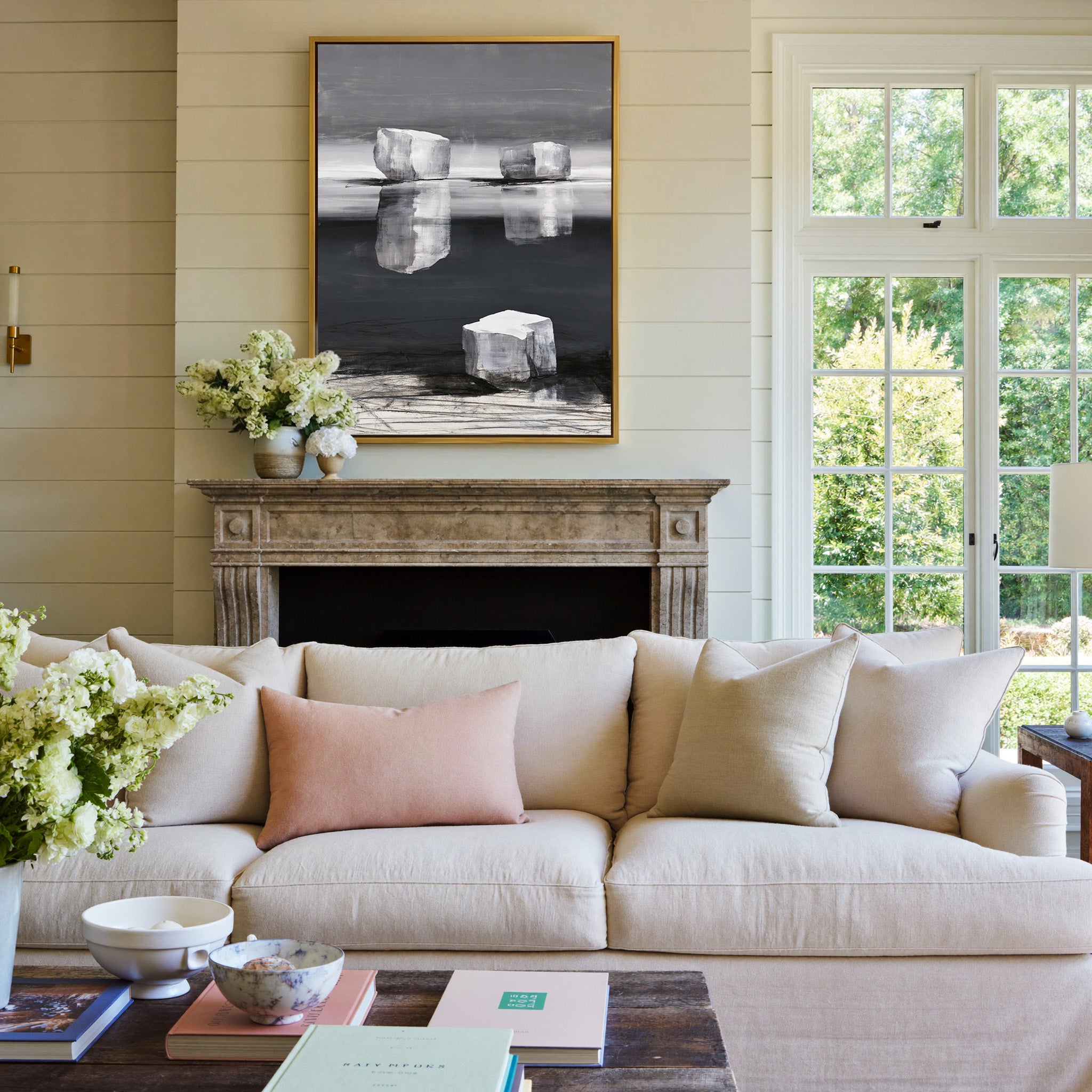monochrome abstract with pale limestone blocks canvas wall art in a gold frame above a mantel