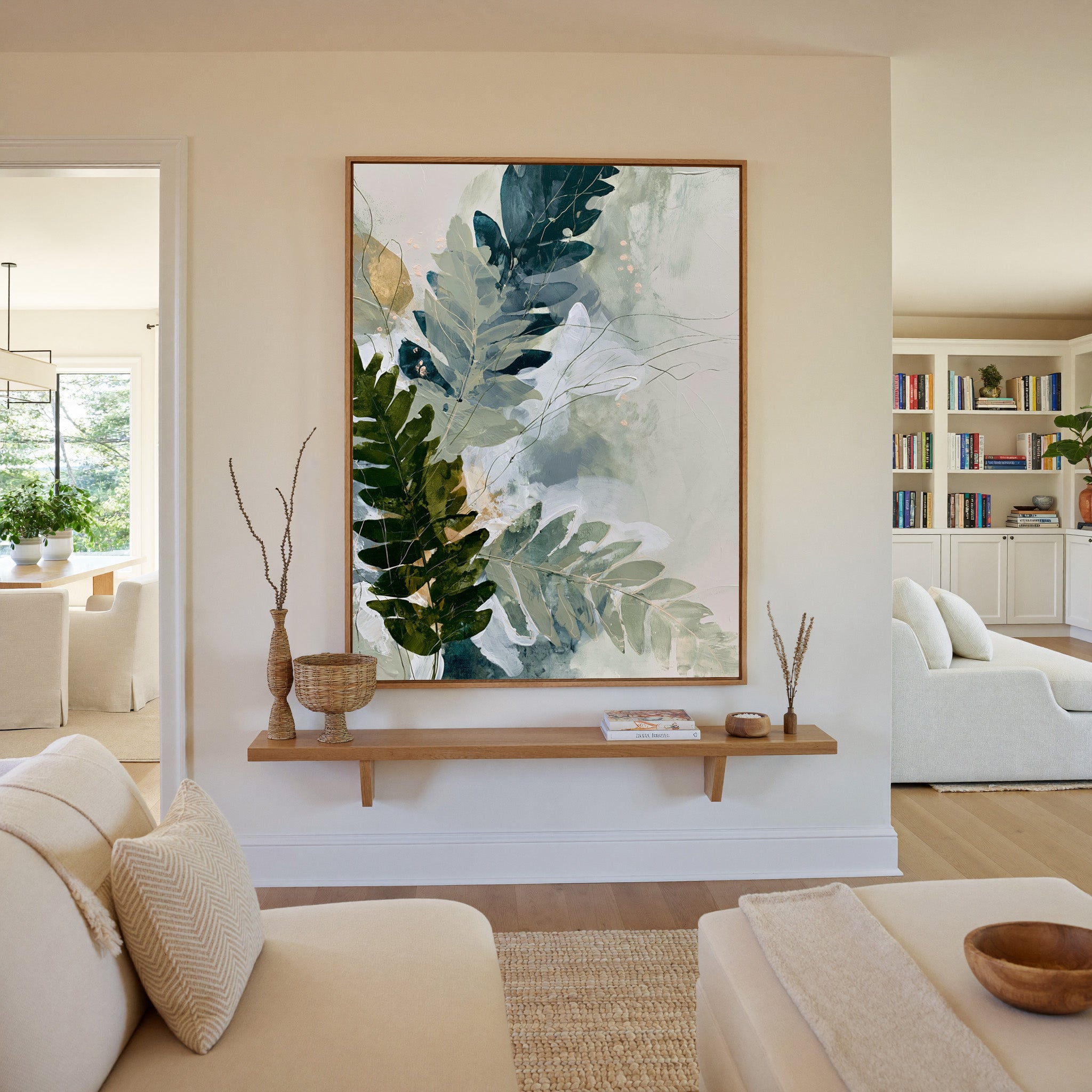 layered fern leaves in sage, moss, slate blue, canvas wall art in an oak frame in a living room