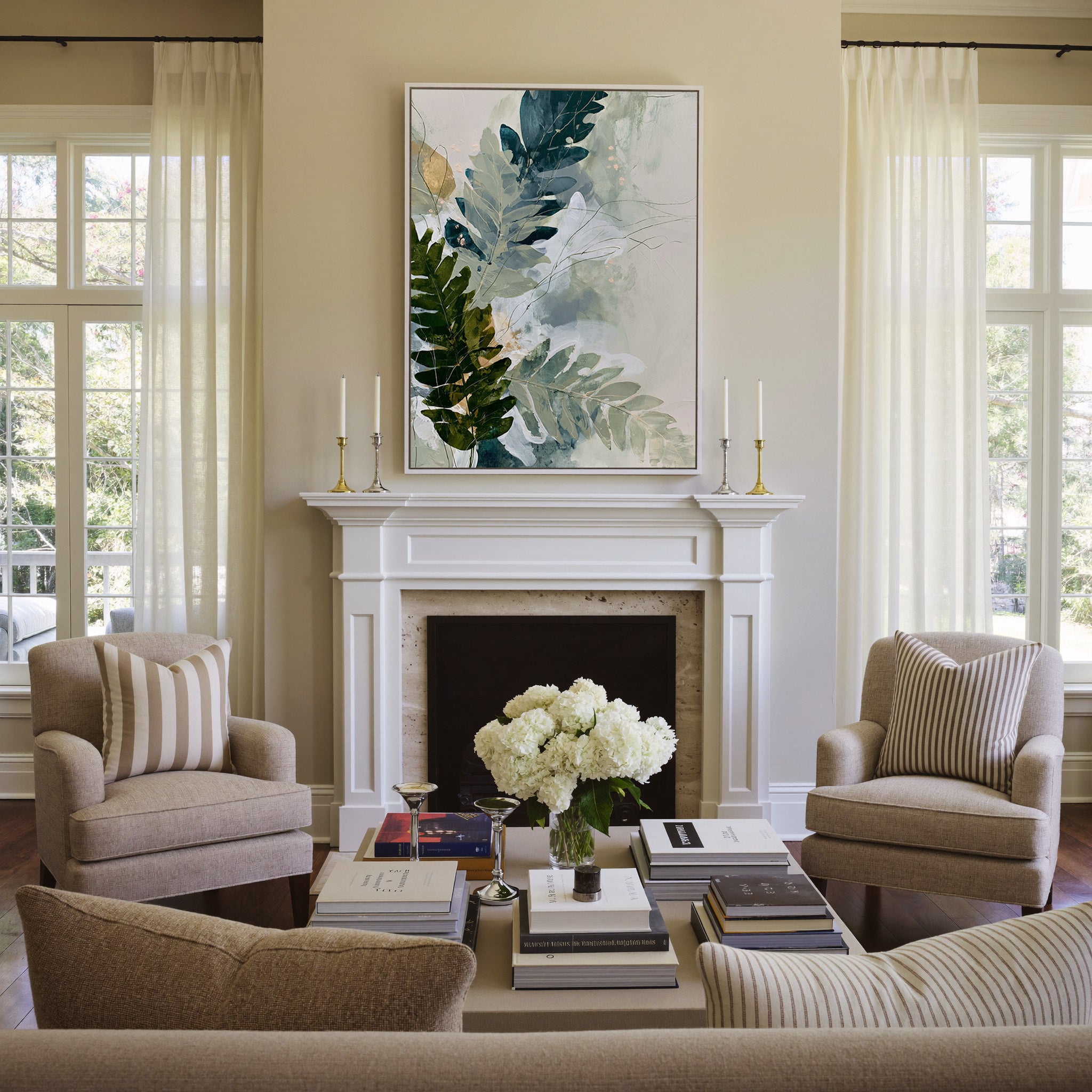 layered fern leaves in sage, moss, slate blue, canvas wall art in a white frame above a mantel