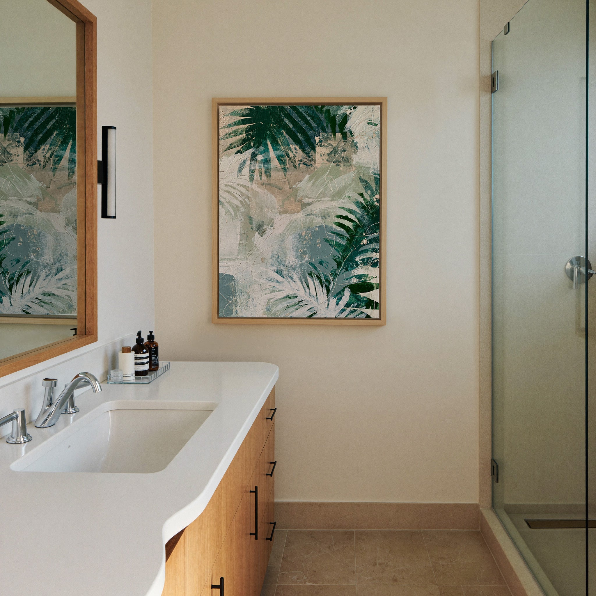 layered fern leaves in deep canvas wall art in a natural wood frame in a styled room setting
