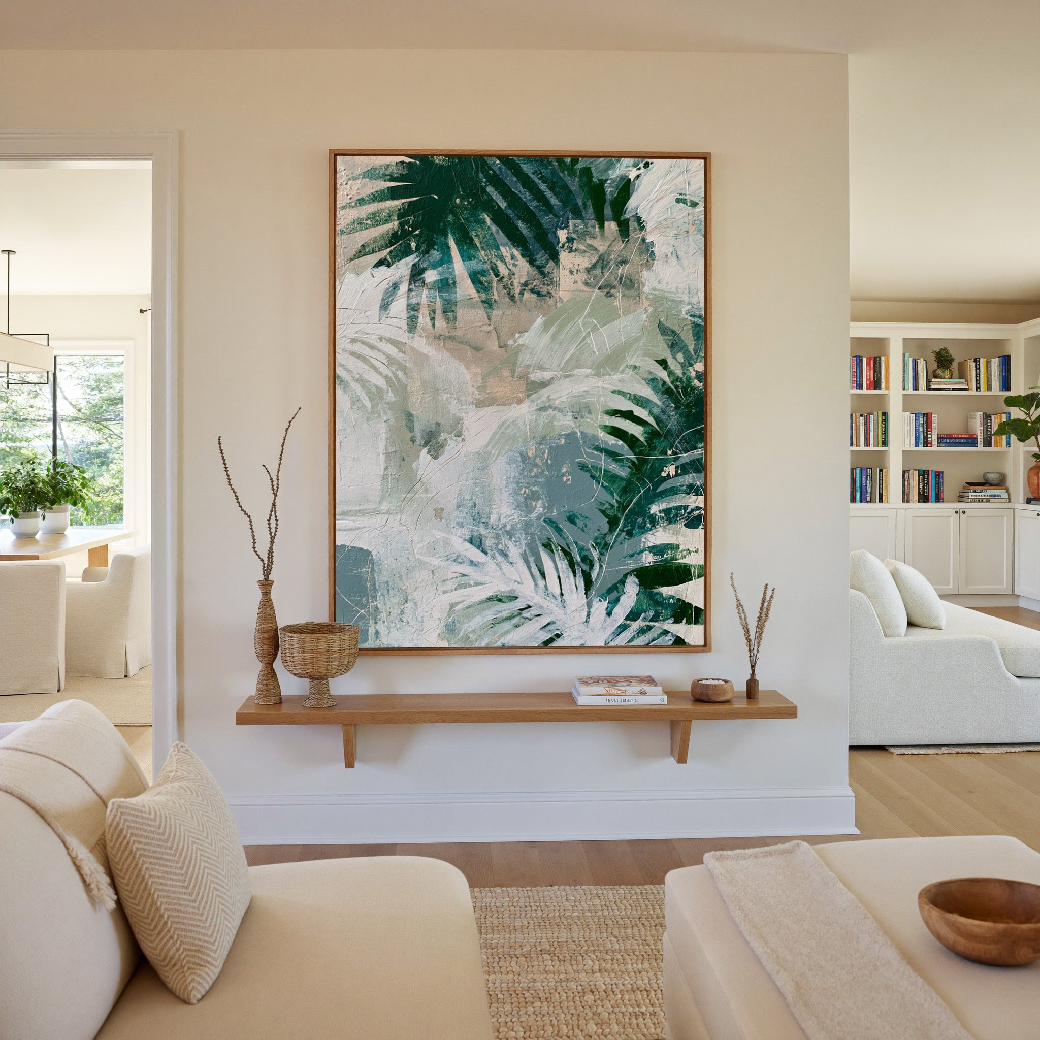 layered fern leaves in deep green, sage, white, canvas wall art in an oak frame in a living room