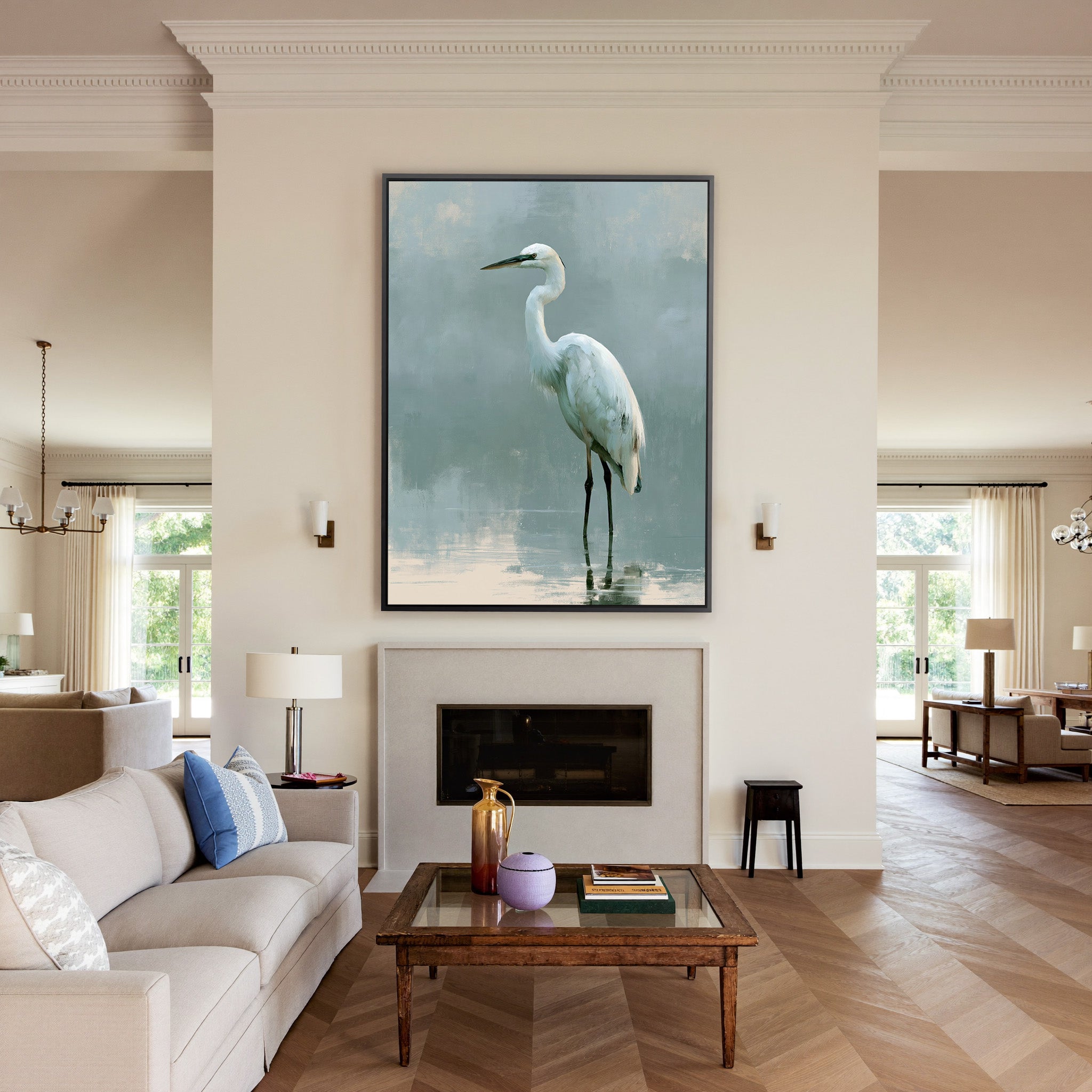 white heron in pale reflective water canvas wall art in a black frame above a mantel