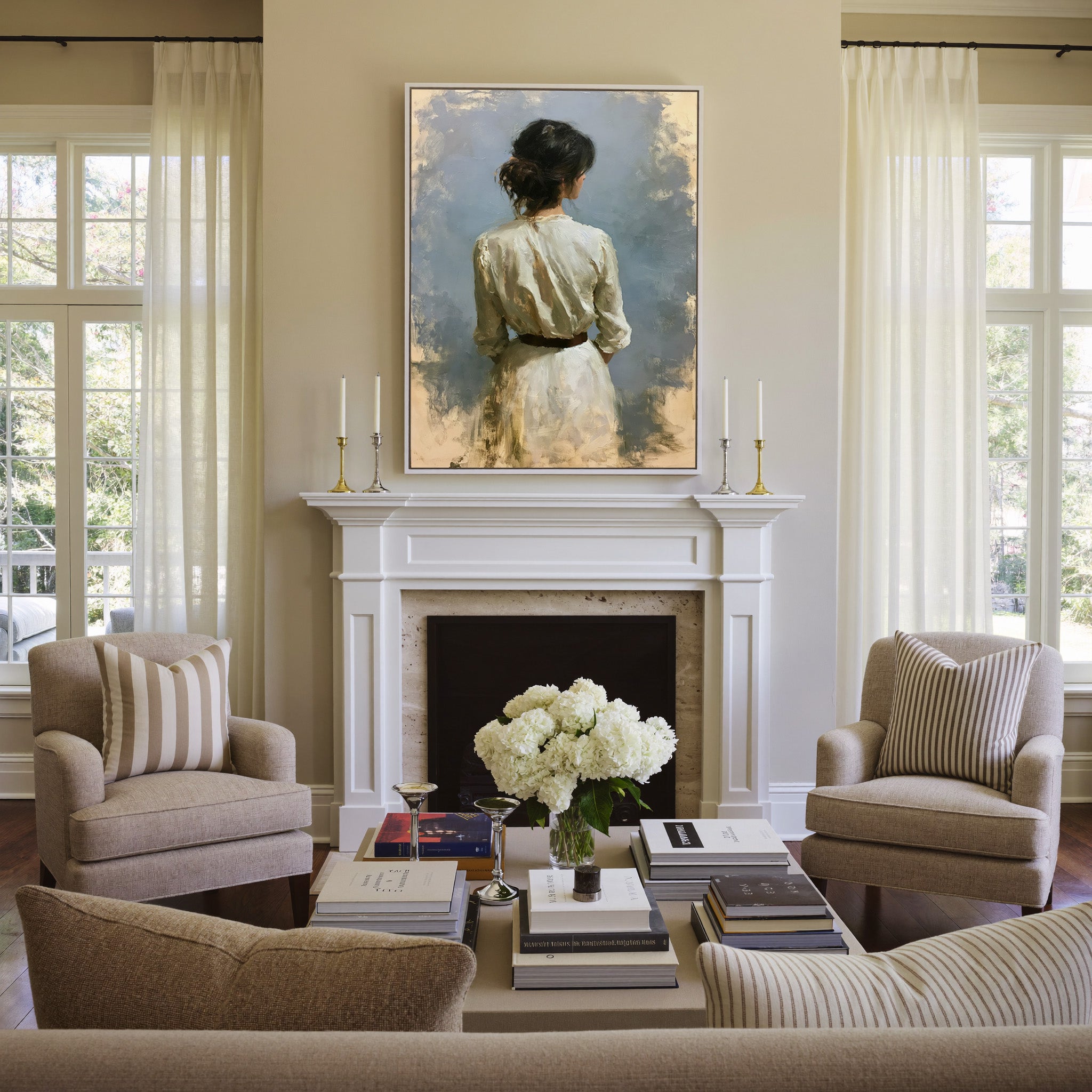 rear view woman in a white dress against a soft canvas wall art in a white frame above a mantel