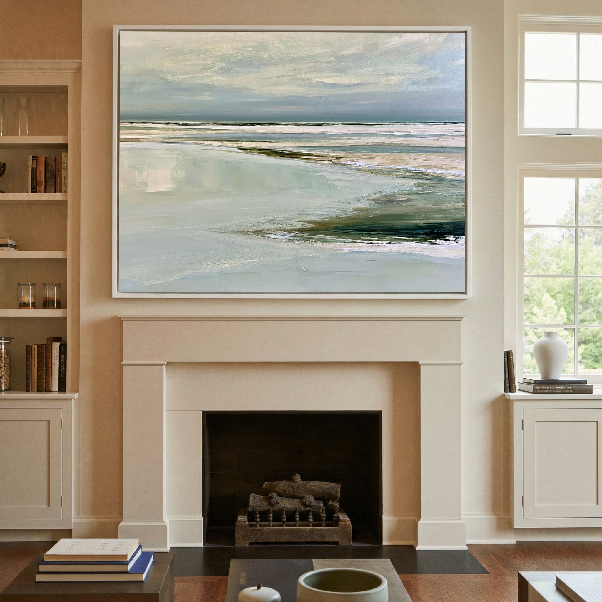 pale reflective shoreline with low horizontal canvas wall art in a white frame above a mantel