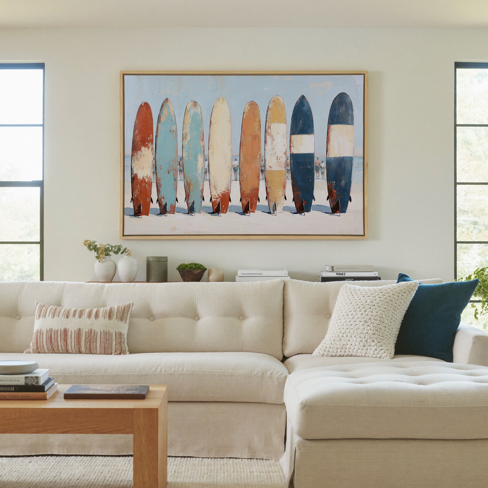row of colorful surfboards on pale sand canvas wall art in a natural wood frame in a living room