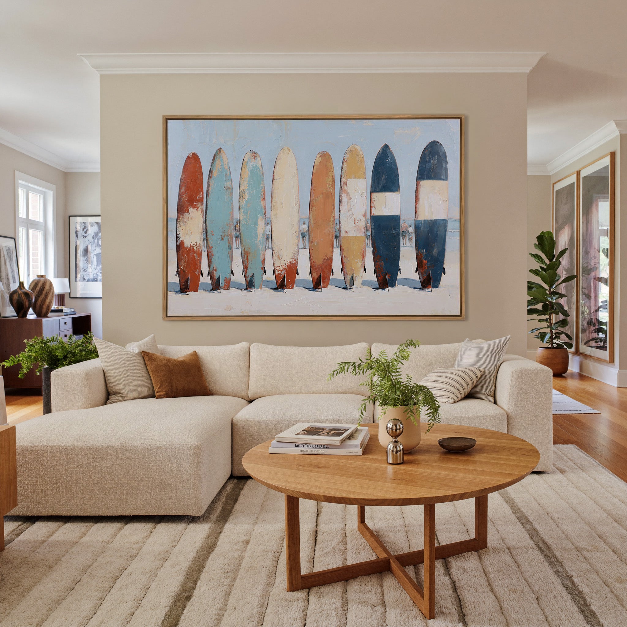 row of colorful surfboards on pale sand canvas wall art in an oak frame in a living room