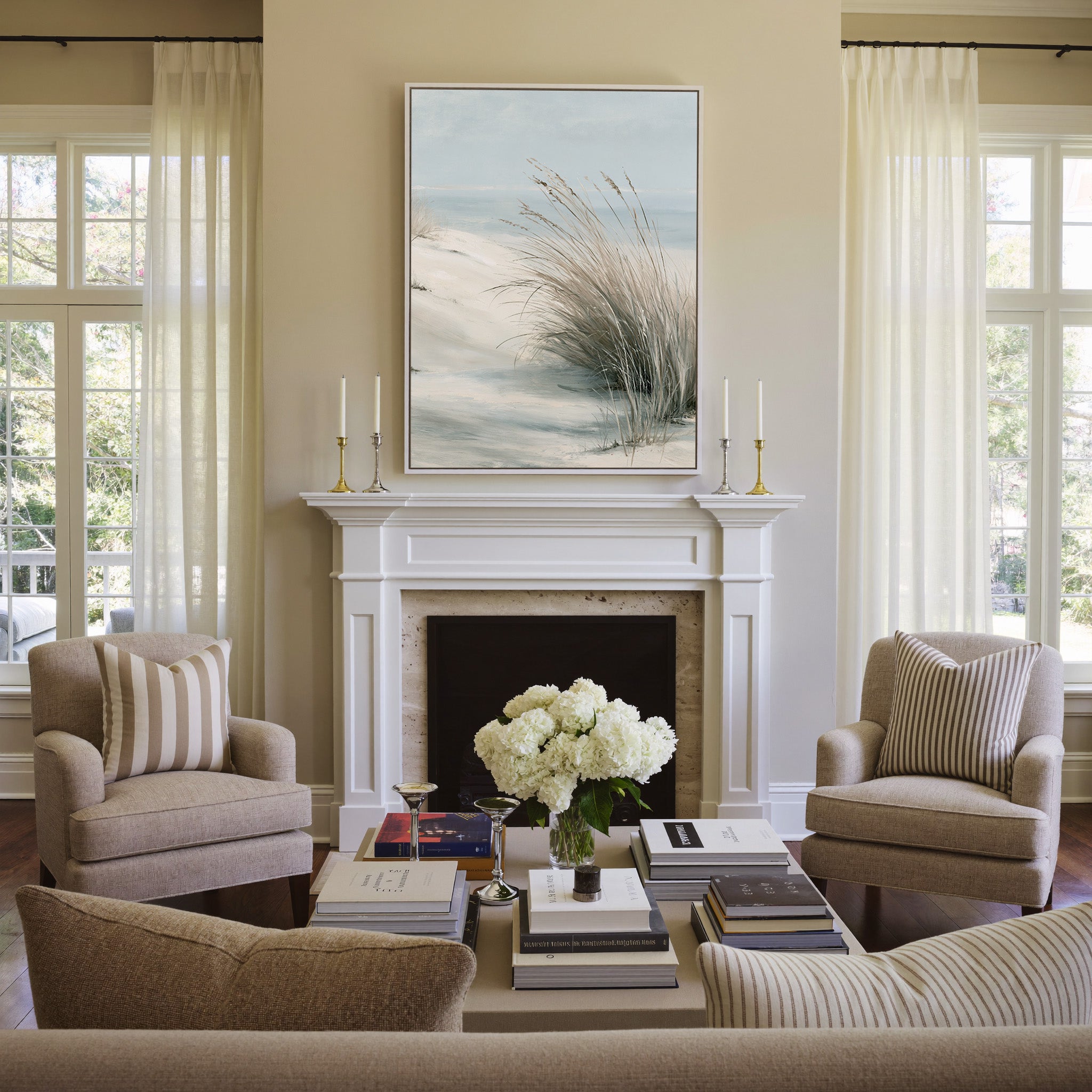 pale dune grass over soft blue water canvas wall art in a white frame above a mantel