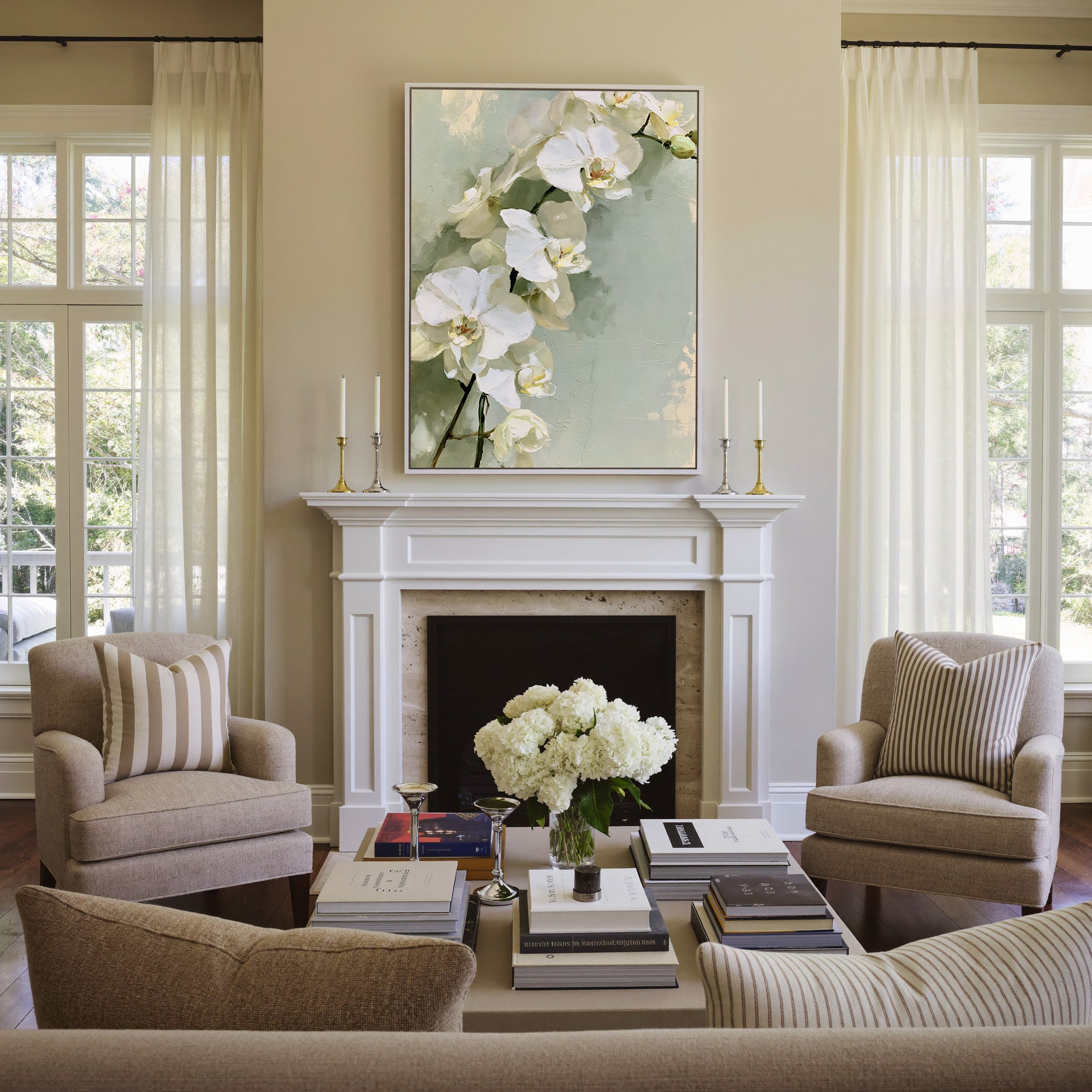 white orchids with long stems on a pale green canvas wall art in a white frame above a mantel