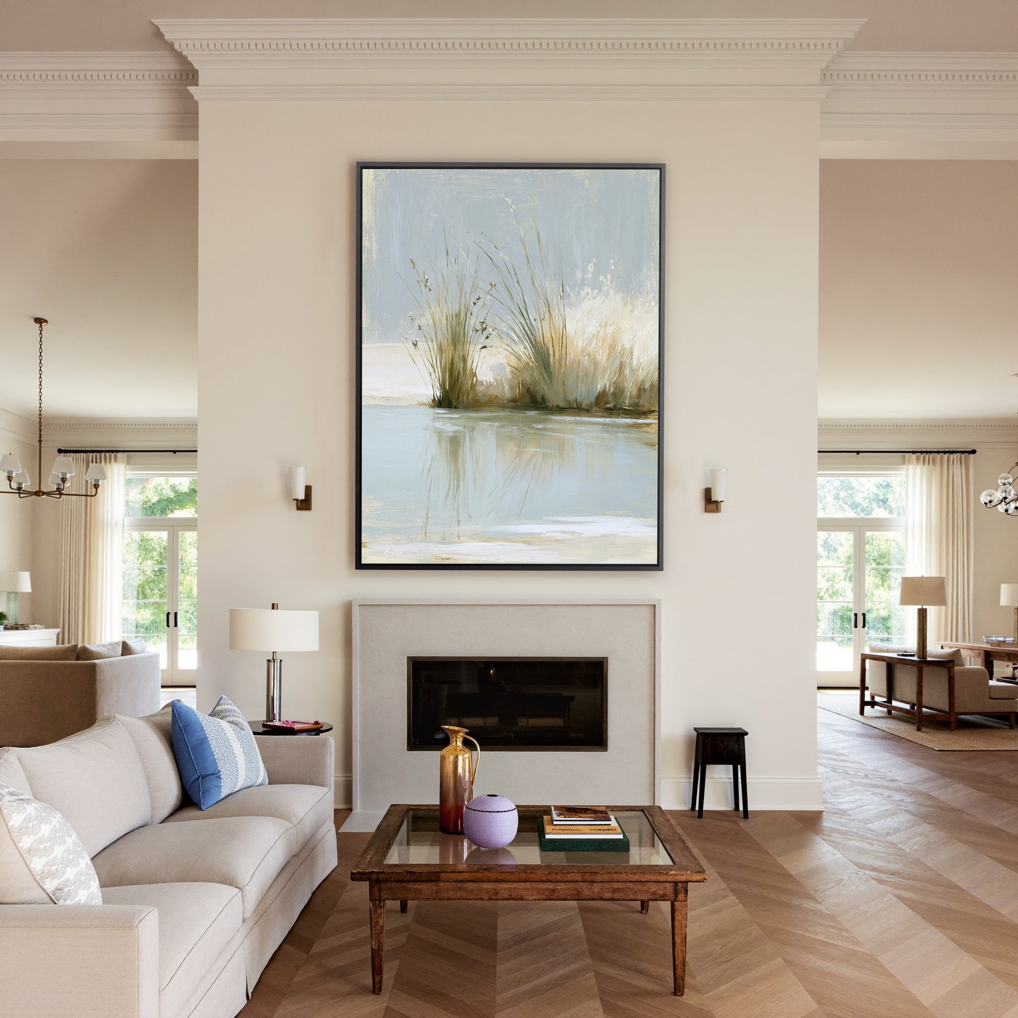 pale reeds and grasses by still water canvas wall art in a black frame above a mantel