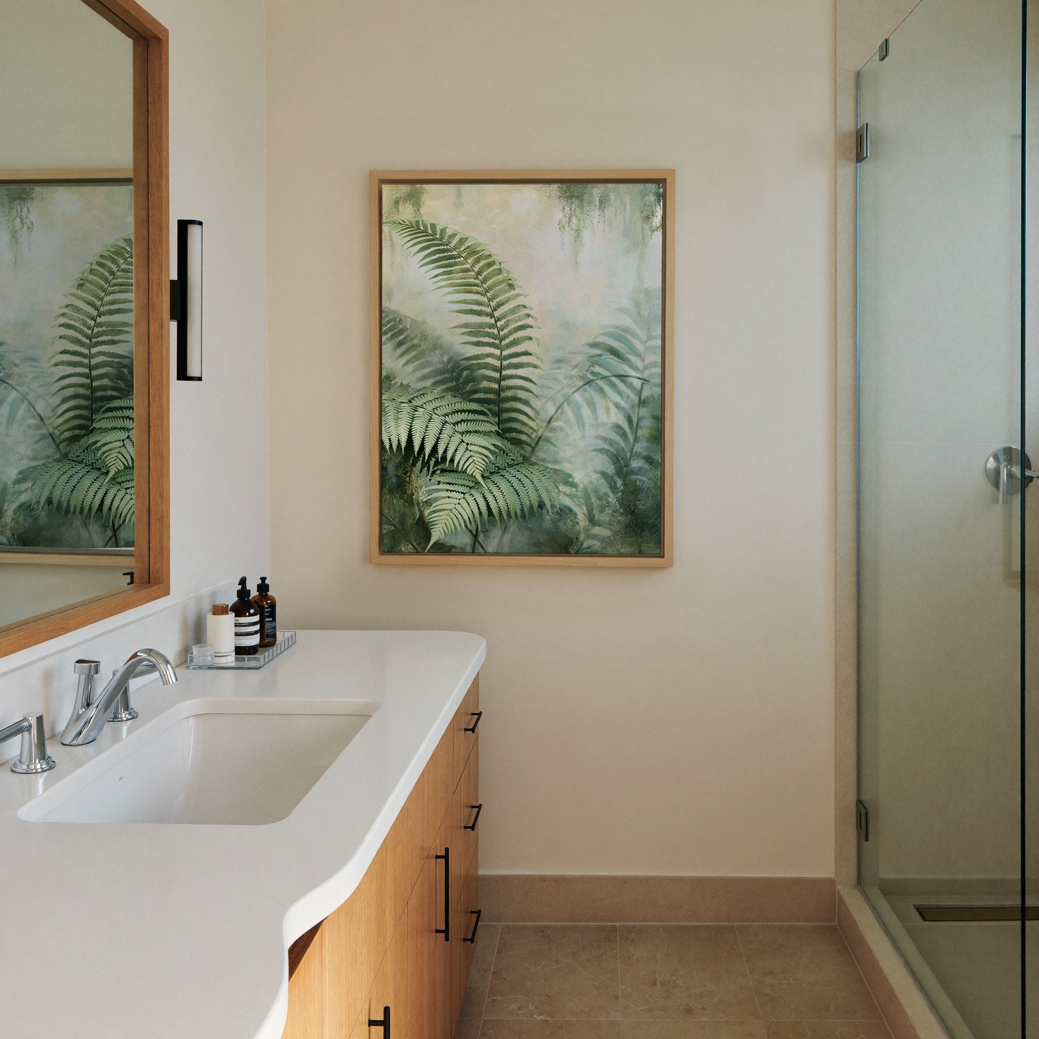 layered green fern fronds in a misty pale canvas wall art in a natural wood frame in a styled room setting
