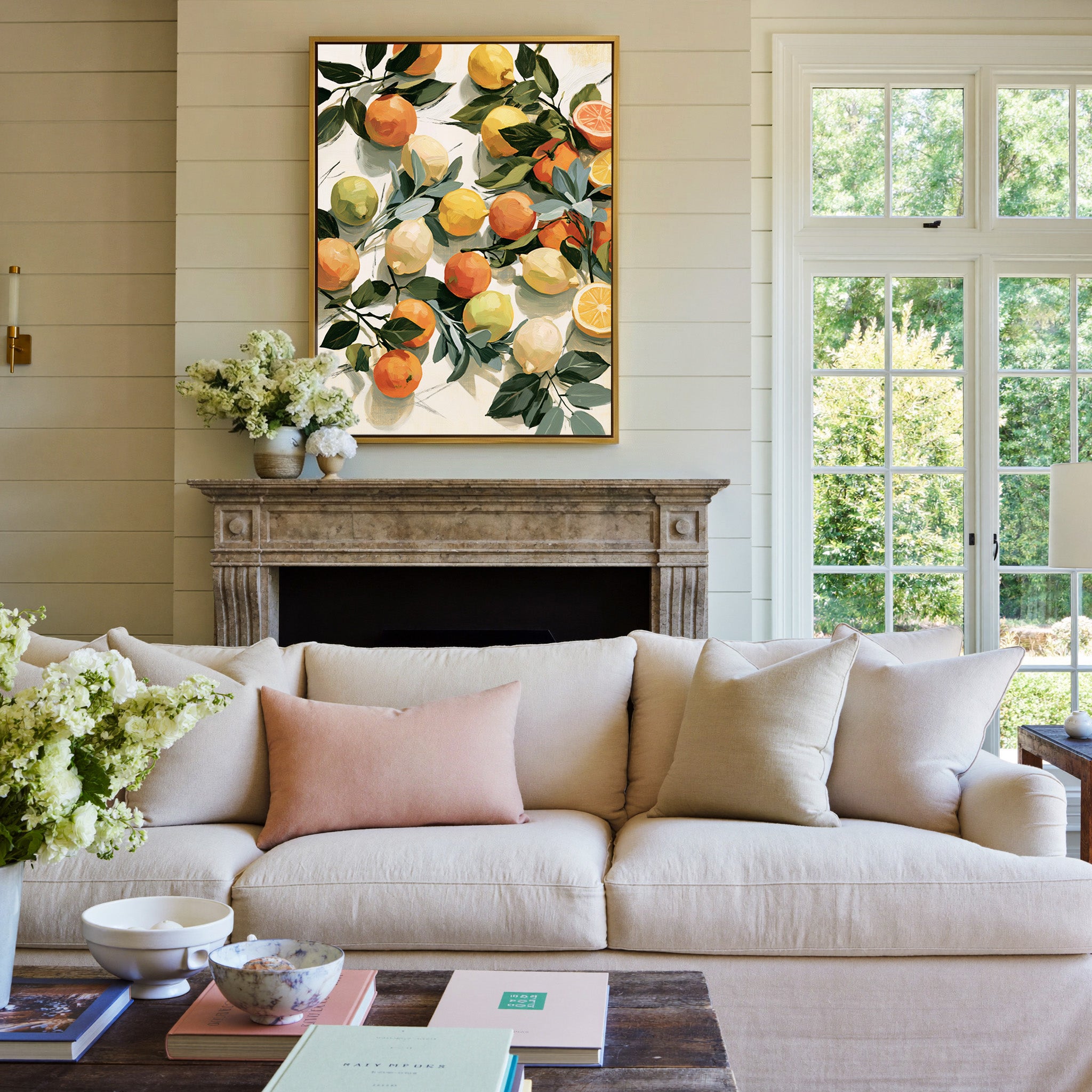 loose citrus still life with dark green leaves canvas wall art in a gold frame above a mantel