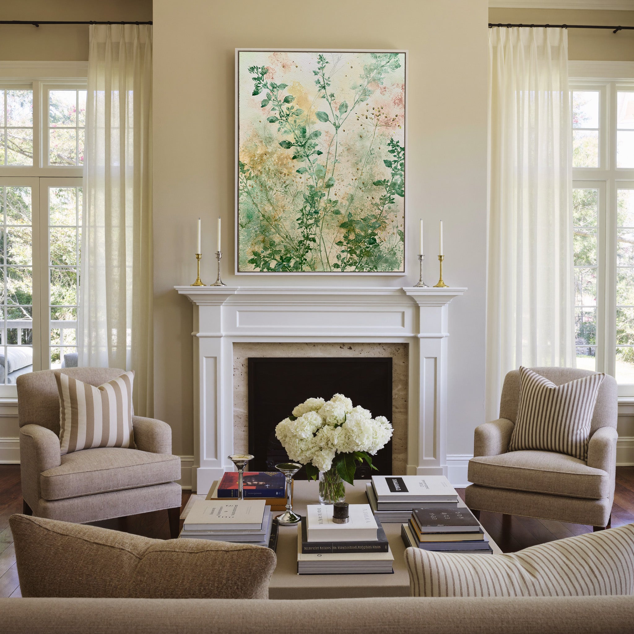 loose herb like stems in sage, cream, and blush canvas wall art in a white frame above a mantel
