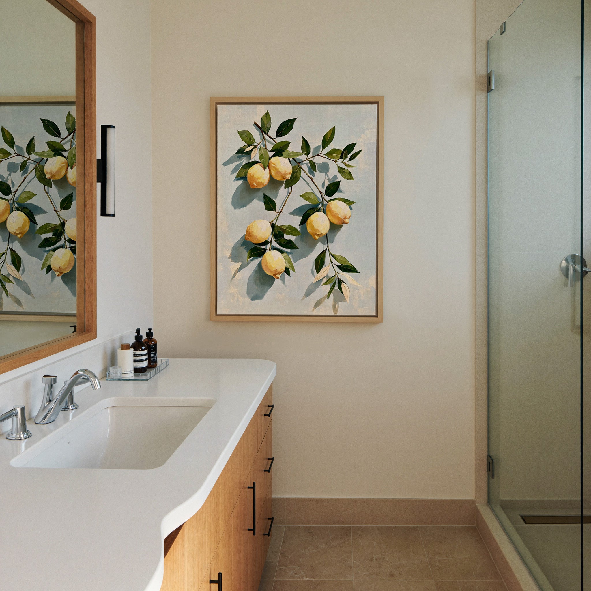 muted lemons with olive leaves on a pale blue canvas wall art in a natural wood frame in a styled room setting