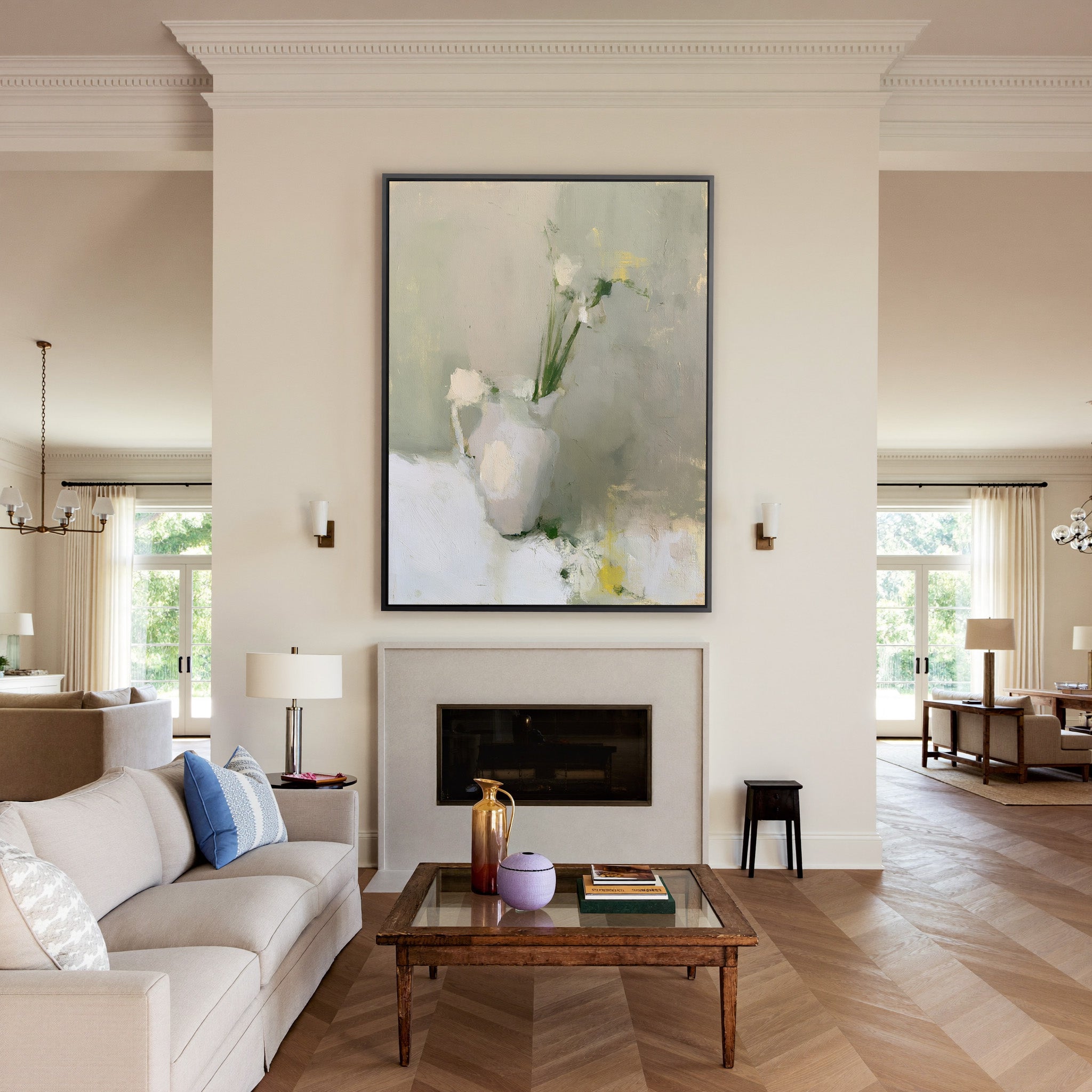 soft neutral still life with a white pitcher canvas wall art in a black frame above a mantel