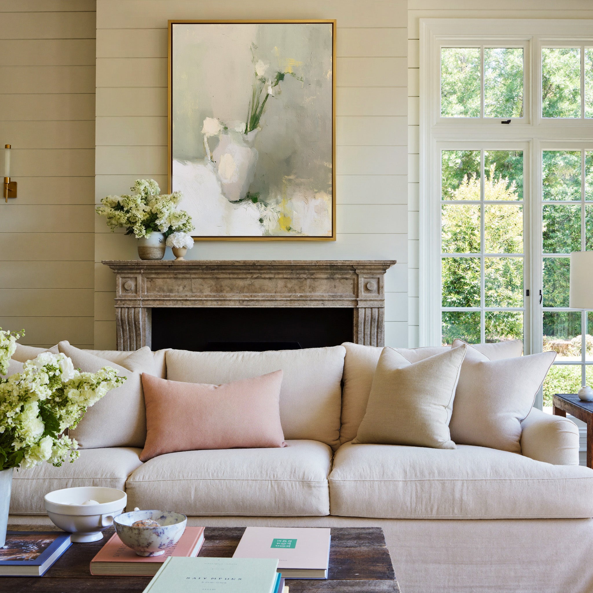 soft neutral still life with a white pitcher canvas wall art in a gold frame above a mantel