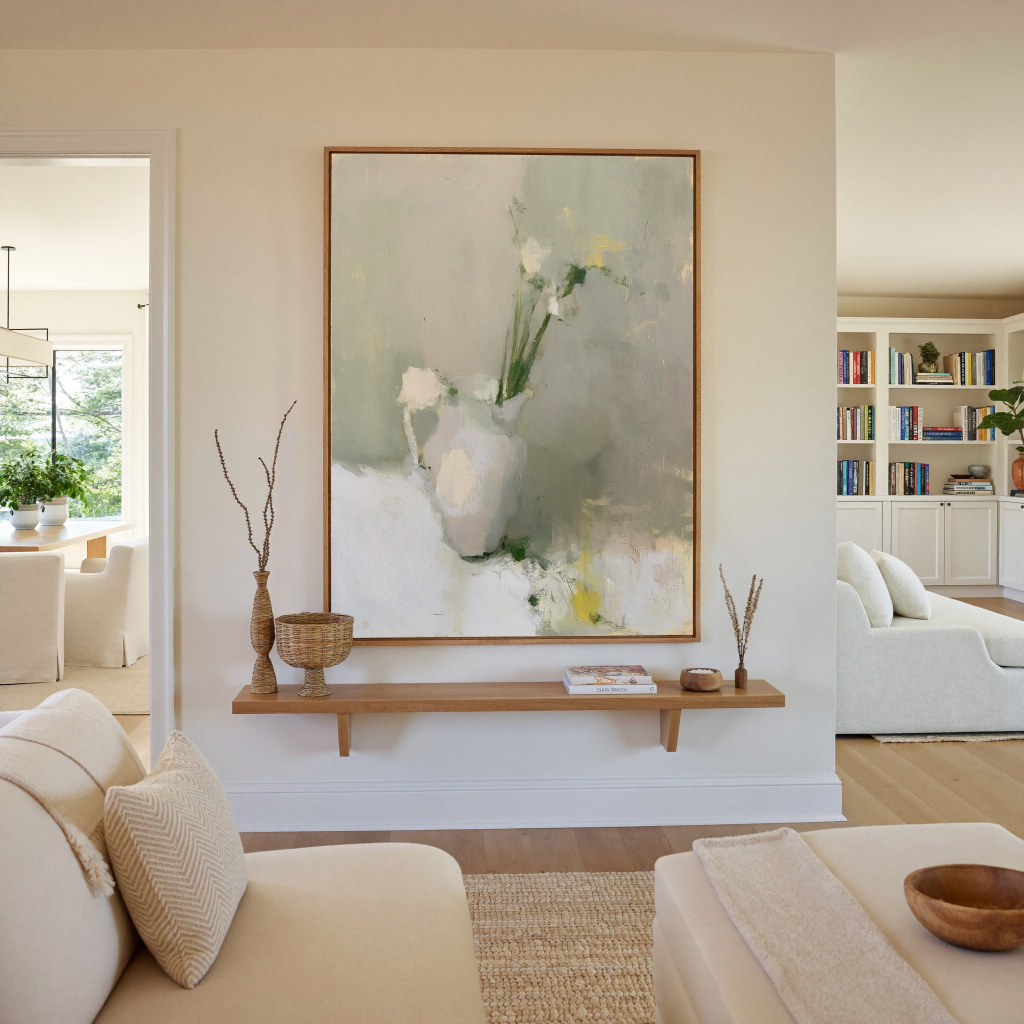 soft neutral still life with a white pitcher canvas wall art in an oak frame in a living room