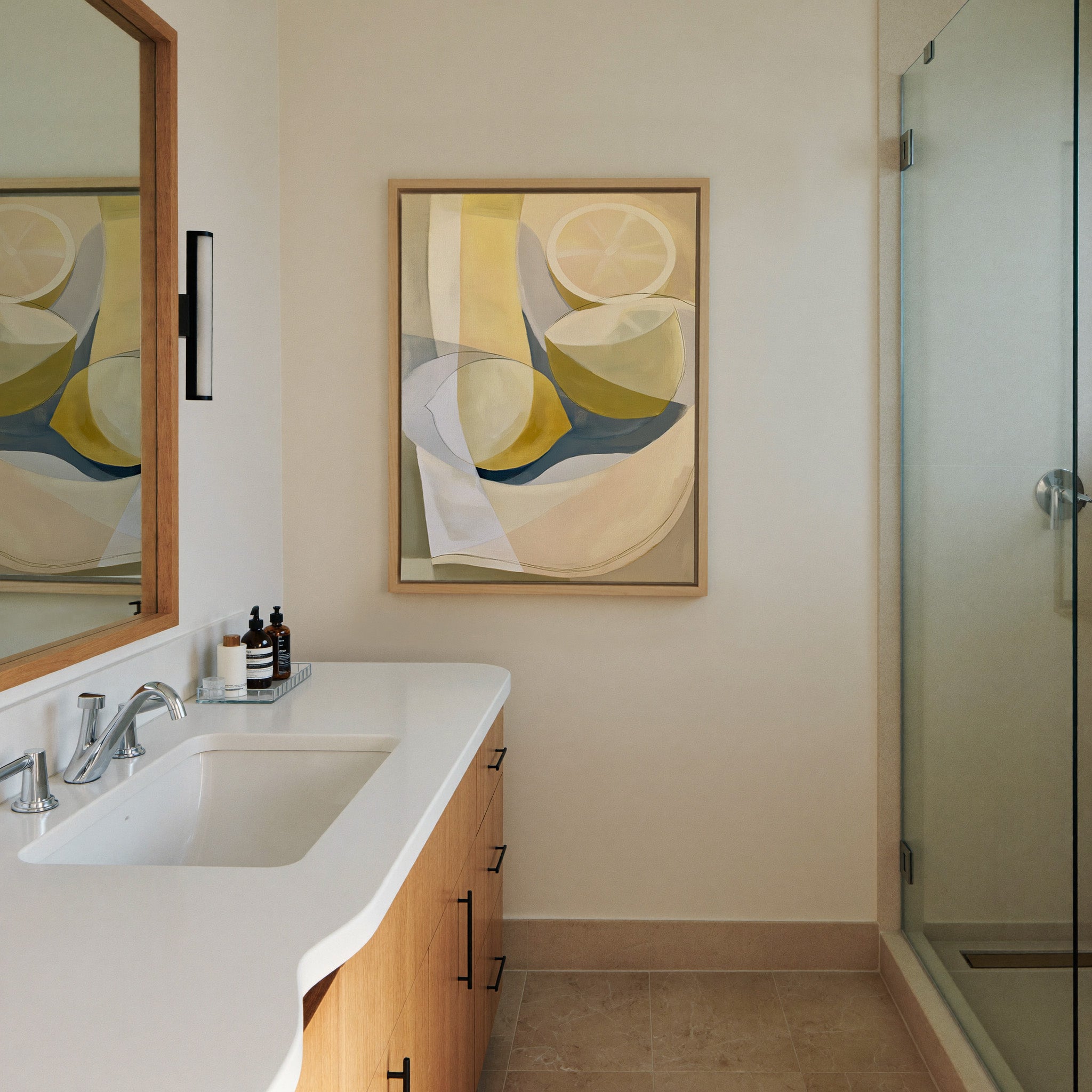 soft cream and yellow abstract still life canvas wall art in a natural wood frame in a styled room setting
