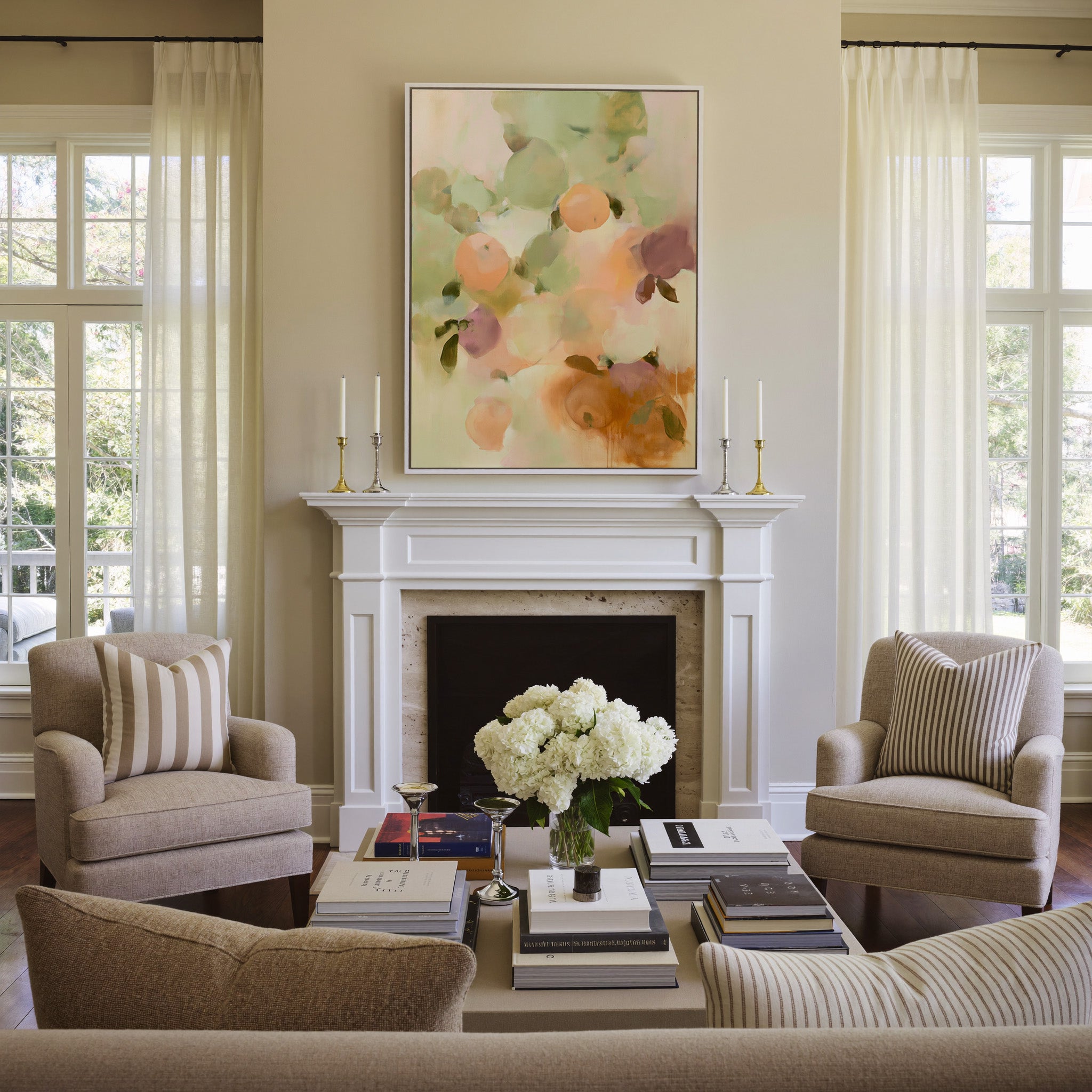 soft orchard toned abstract with pale green, canvas wall art in a white frame above a mantel
