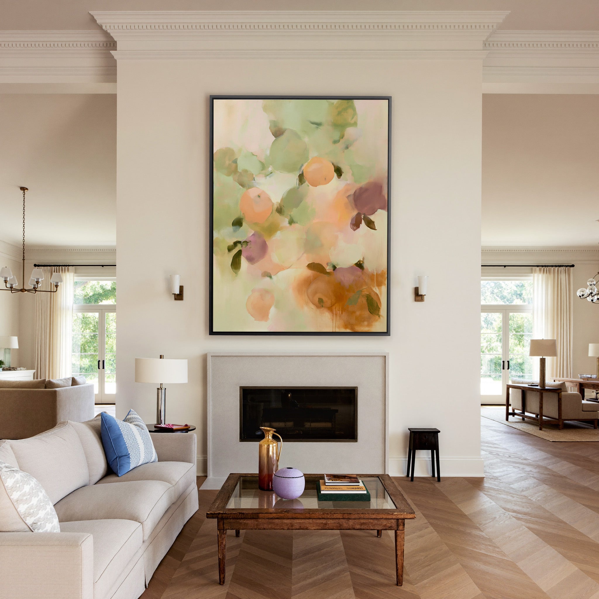 soft orchard toned abstract with pale green, canvas wall art in a black frame above a mantel