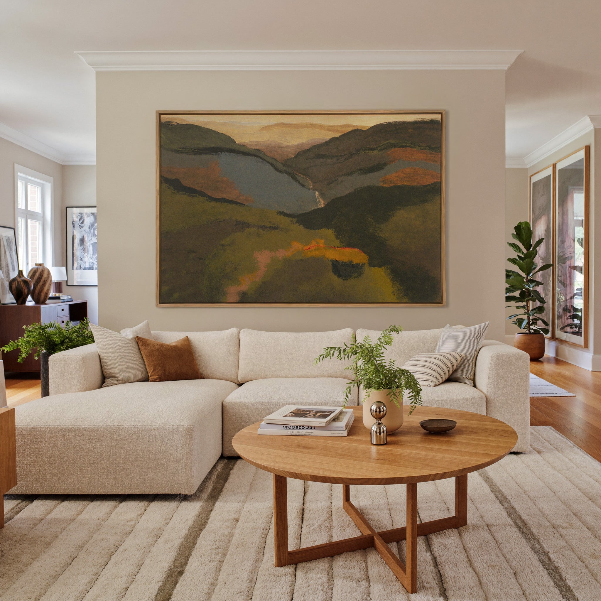 layered mountain valley at dusk canvas wall art in an oak frame in a living room