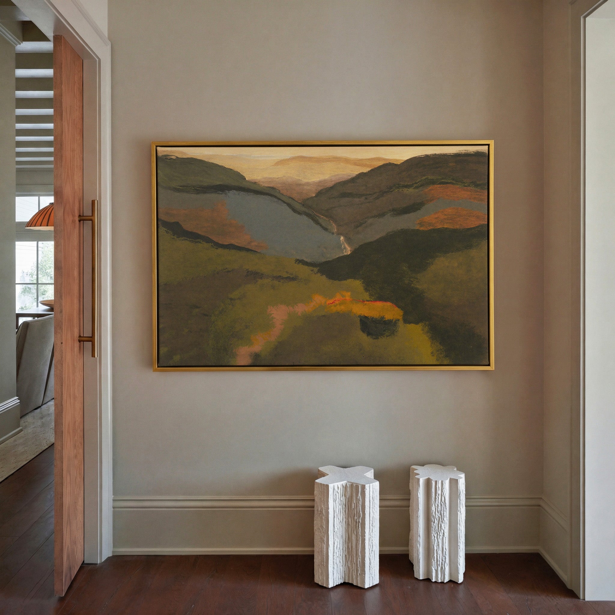 layered mountain valley at dusk canvas wall art in a gold frame in a styled room setting
