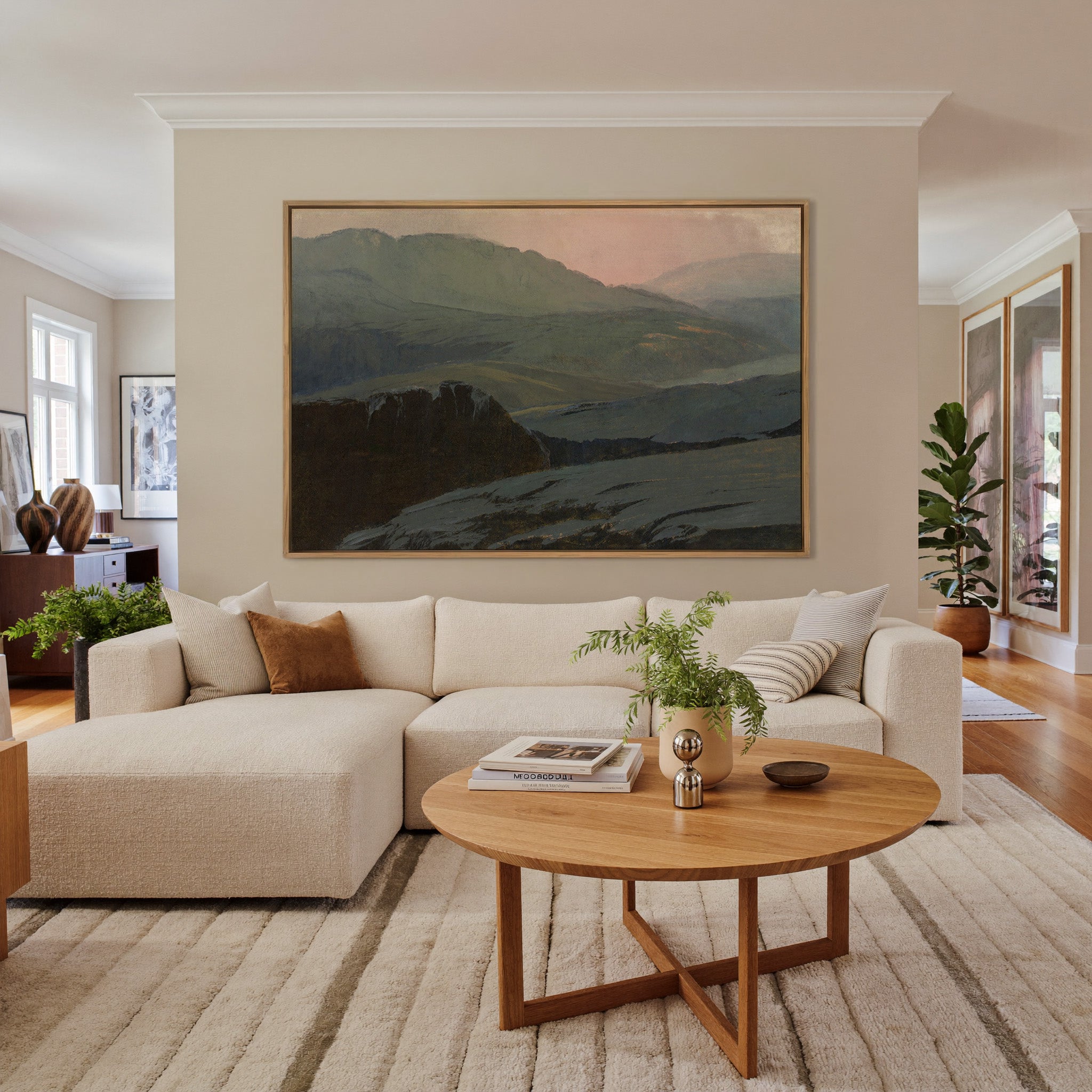misty mountain landscape with dark foreground canvas wall art in an oak frame in a living room