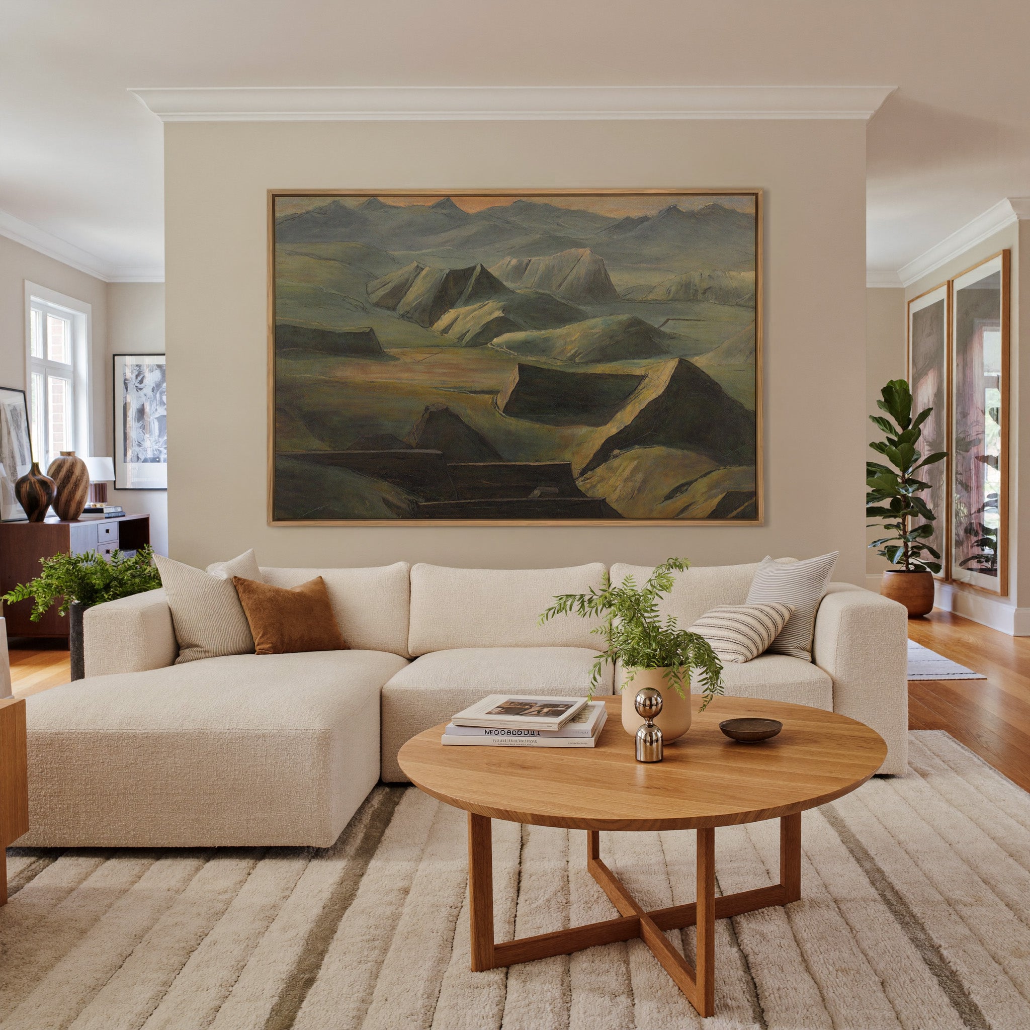 layered mountain ridges with copper light canvas wall art in an oak frame in a living room