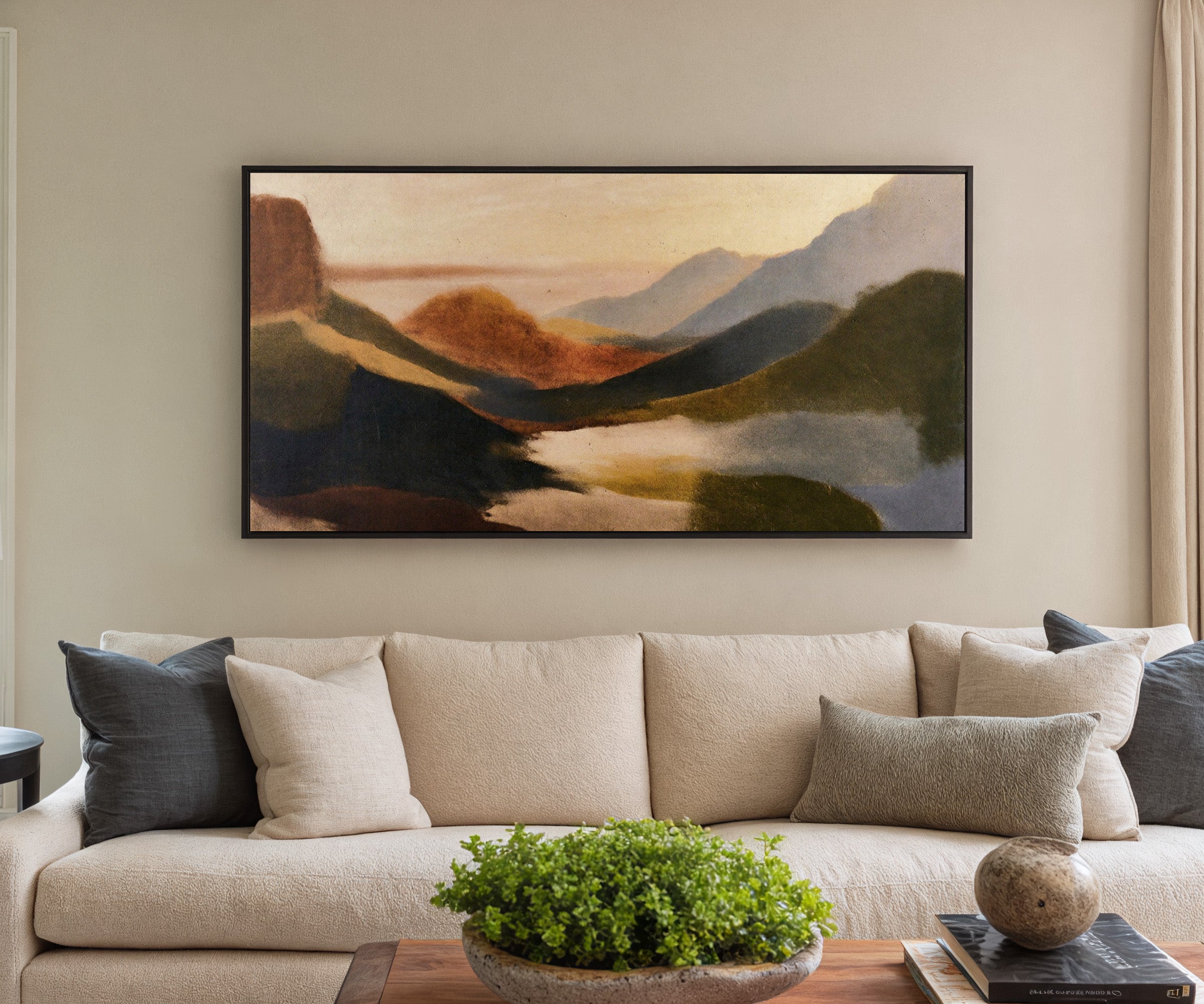 layered coastal landscape with dark headlands, canvas wall art in a black frame in a styled room setting