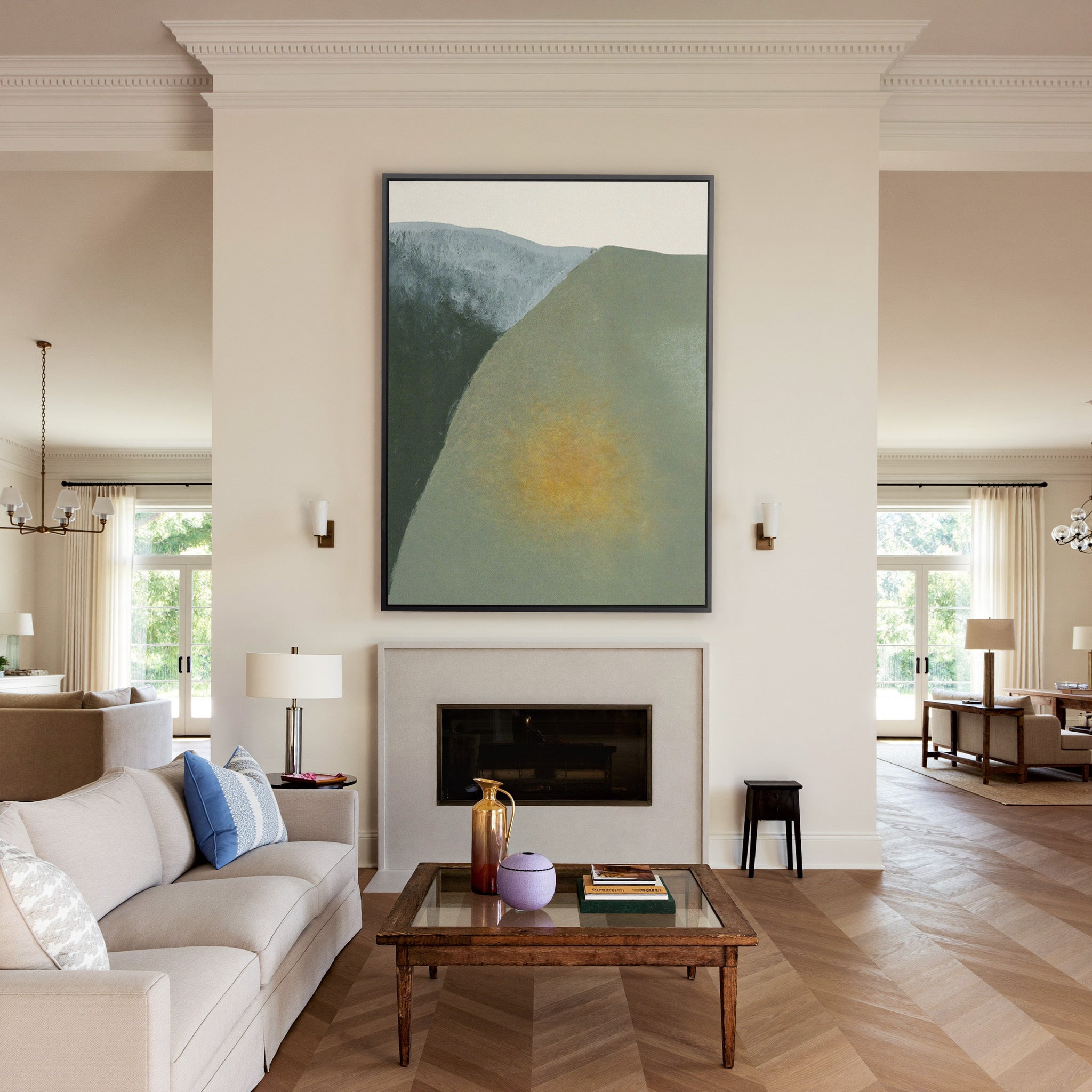 soft olive and charcoal abstract with a warm canvas wall art in a black frame above a mantel