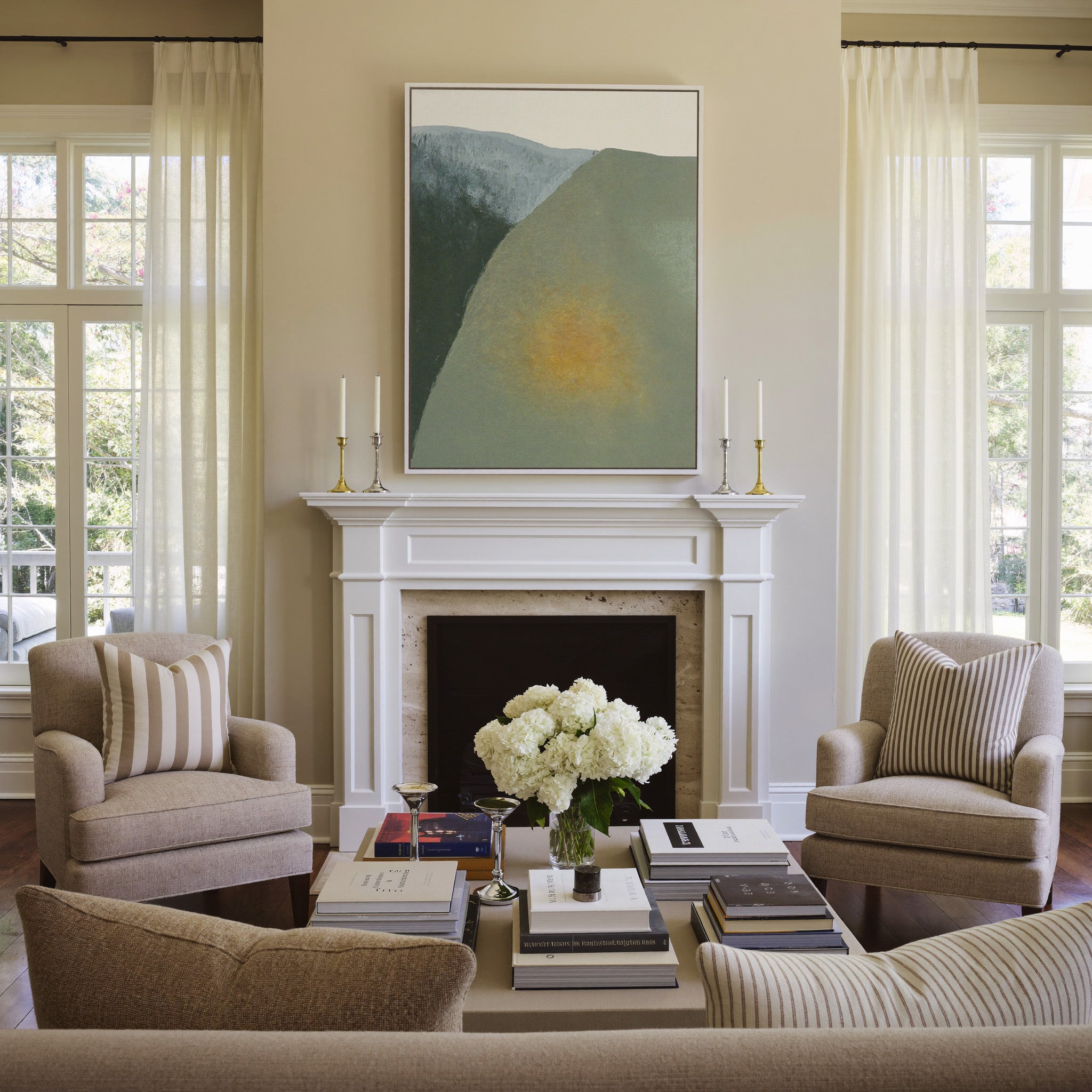 soft olive and charcoal abstract with a warm canvas wall art in a white frame above a mantel