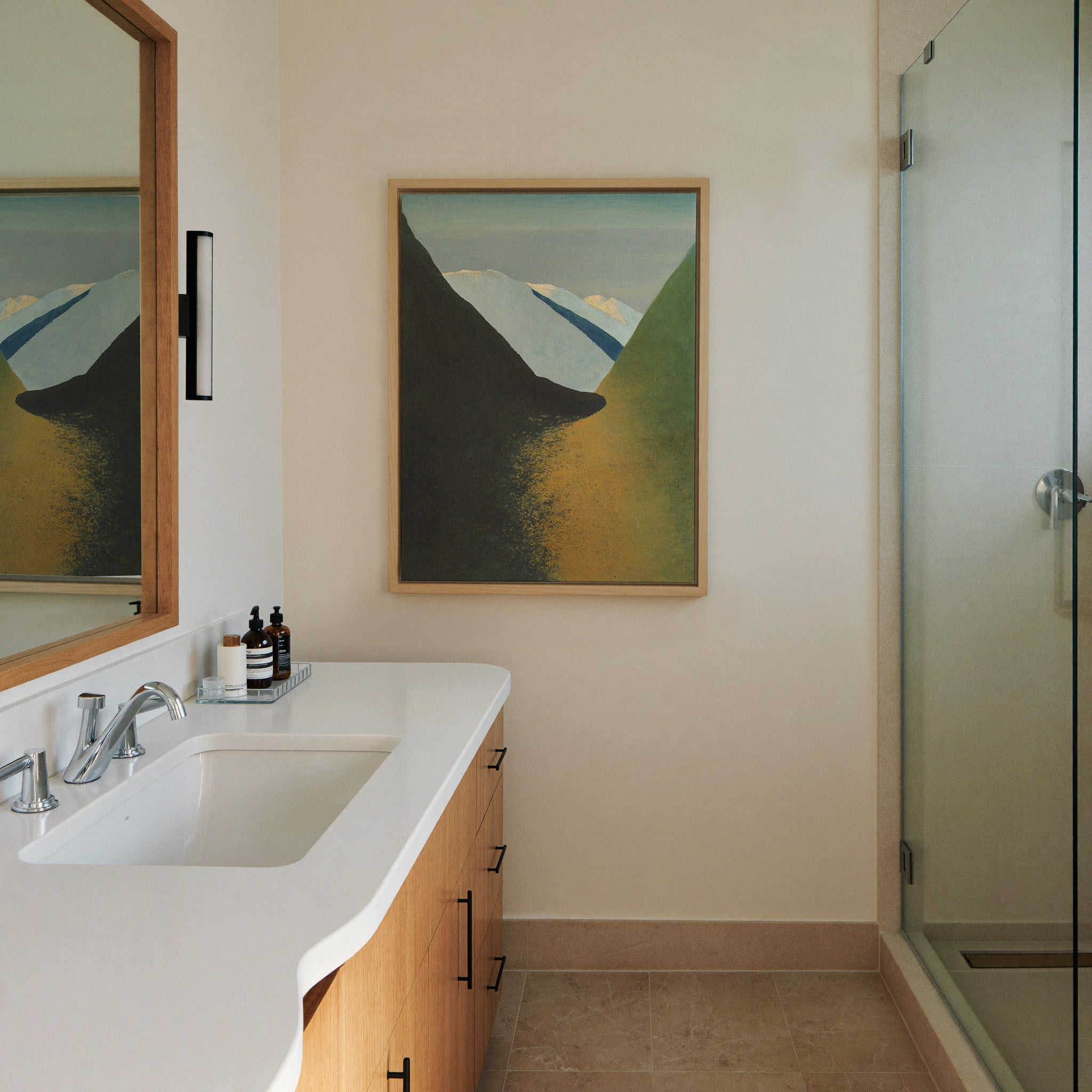 dark foreground slopes with pale canvas wall art in a natural wood frame in a styled room setting