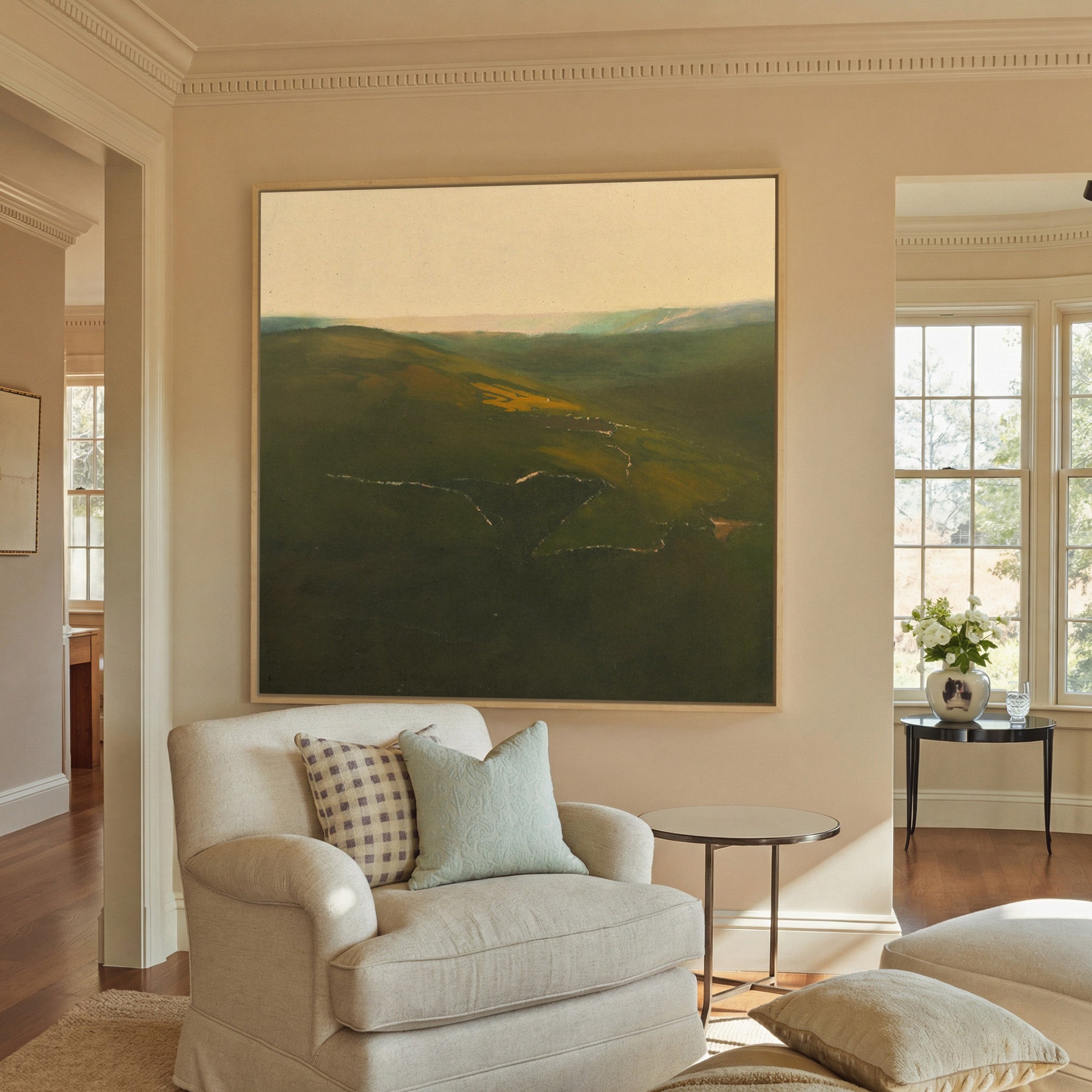 green valley landscape with a canvas wall art in a natural wood frame in a styled room setting