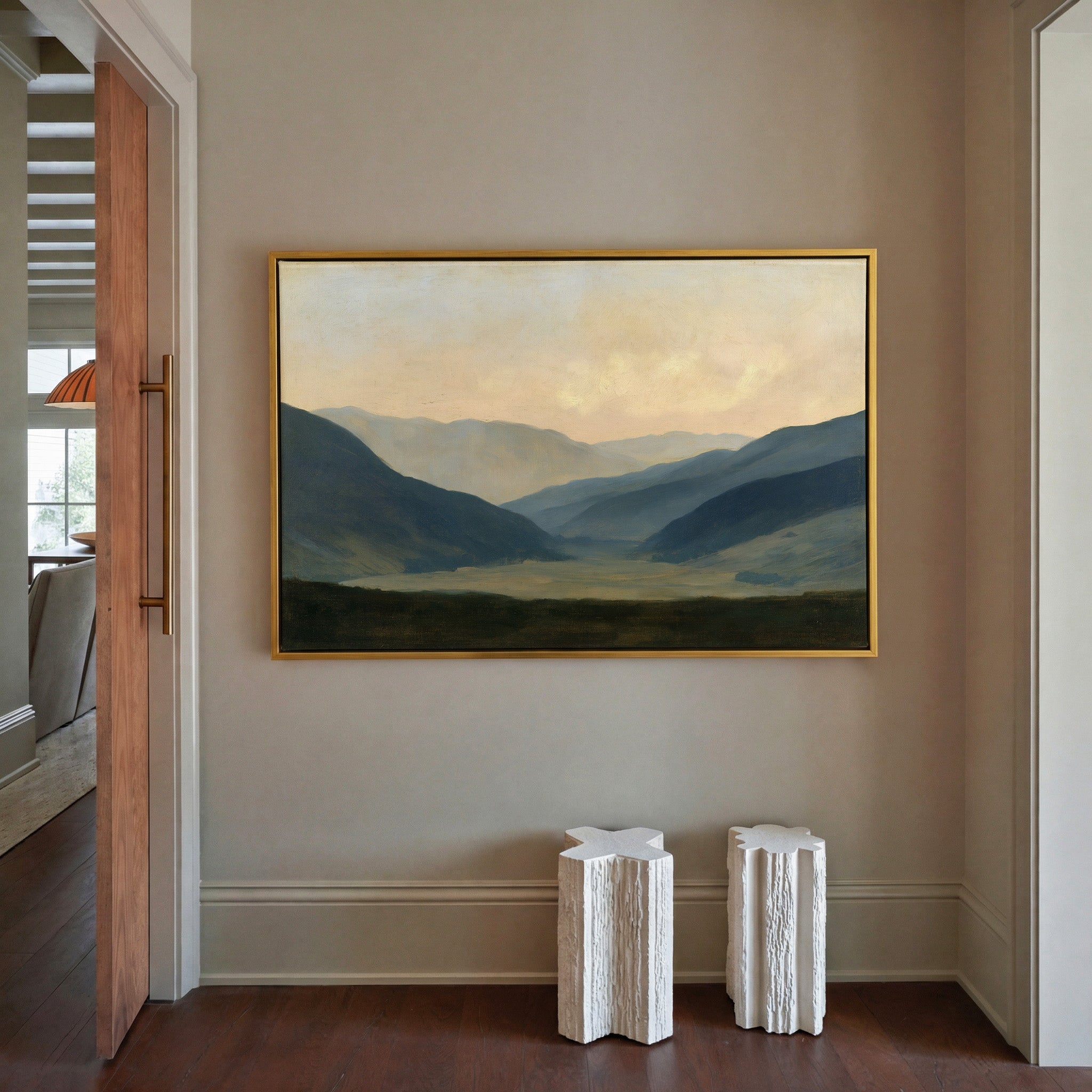 soft blue mountain valley at dawn canvas wall art in a gold frame in a styled room setting