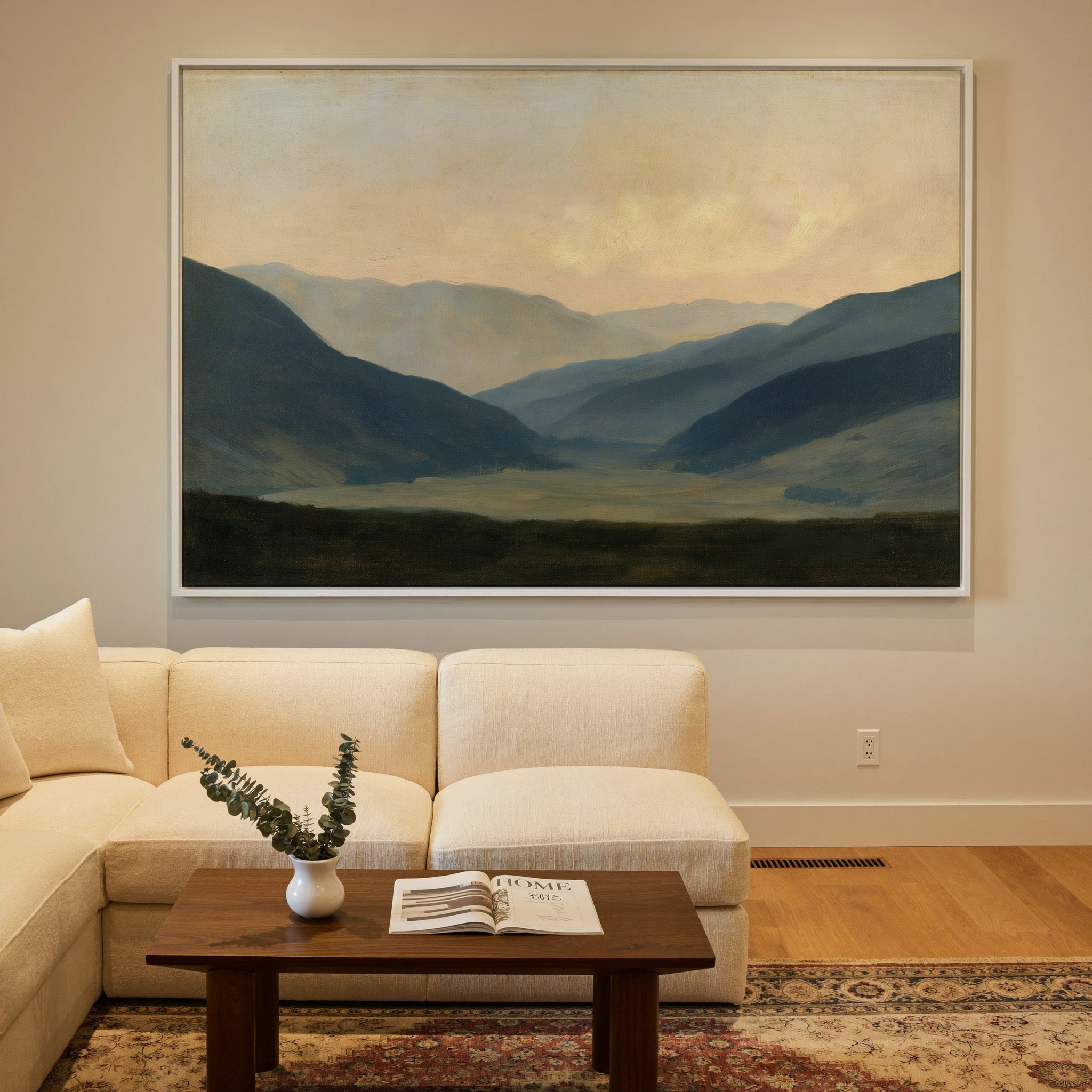 soft blue mountain valley at dawn canvas wall art in a white frame in a styled room setting