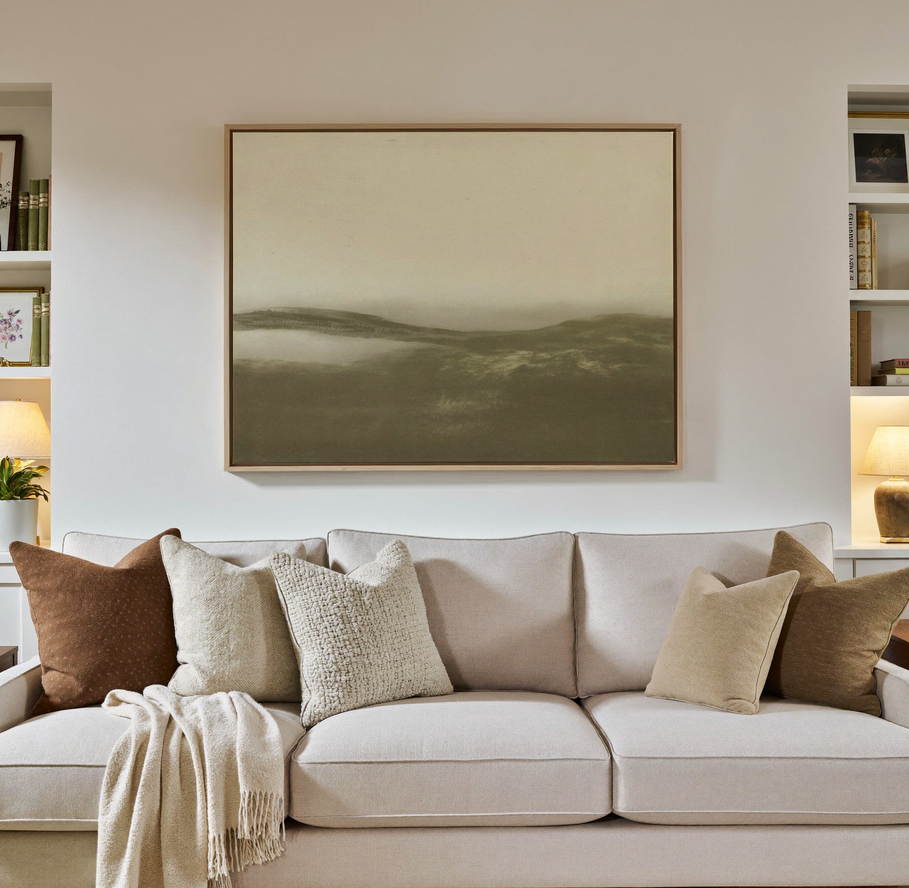 soft sepia mist over low rolling hills canvas wall art in a natural wood frame in a styled room setting