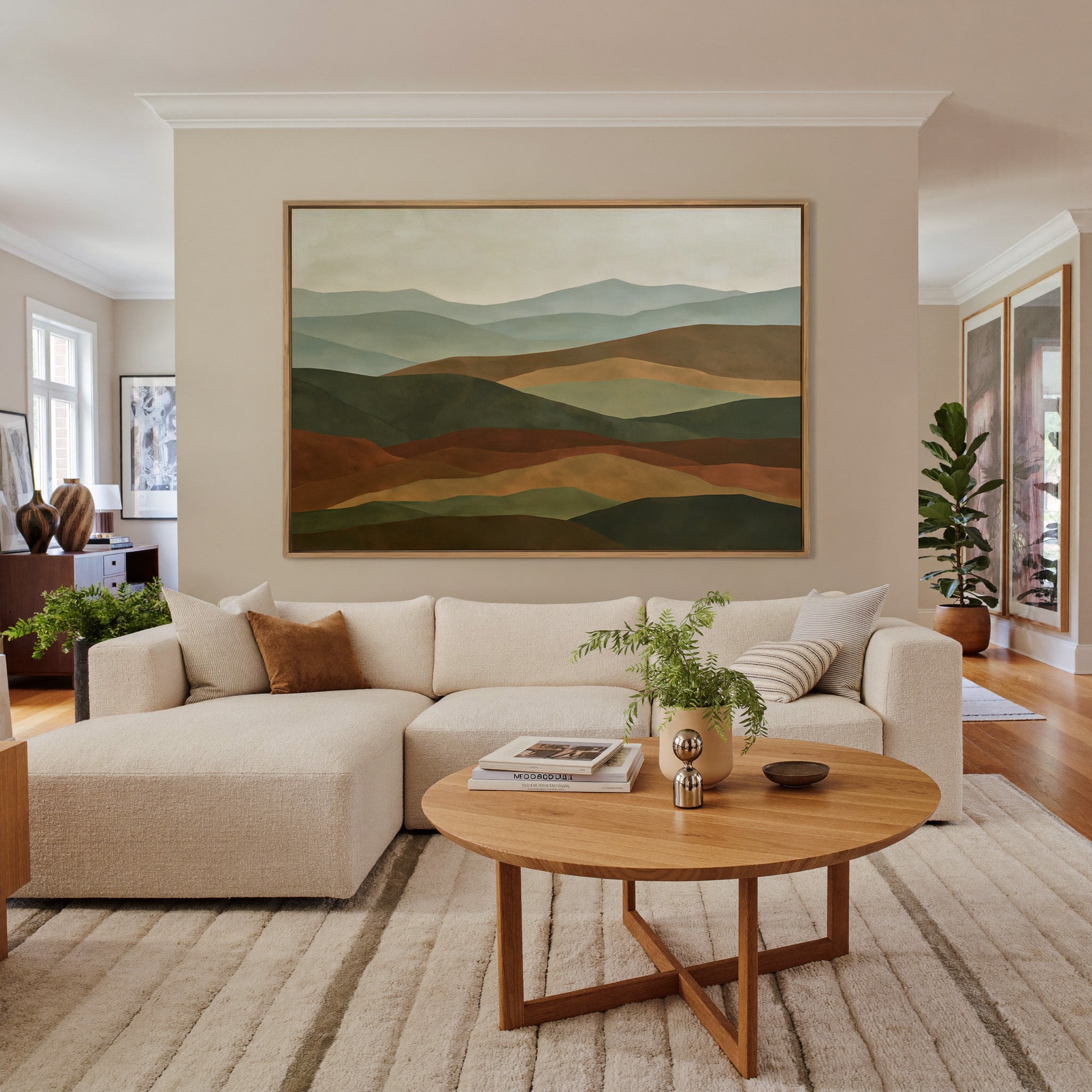 layered hills in sage, olive, rust, and tan canvas wall art in an oak frame in a living room