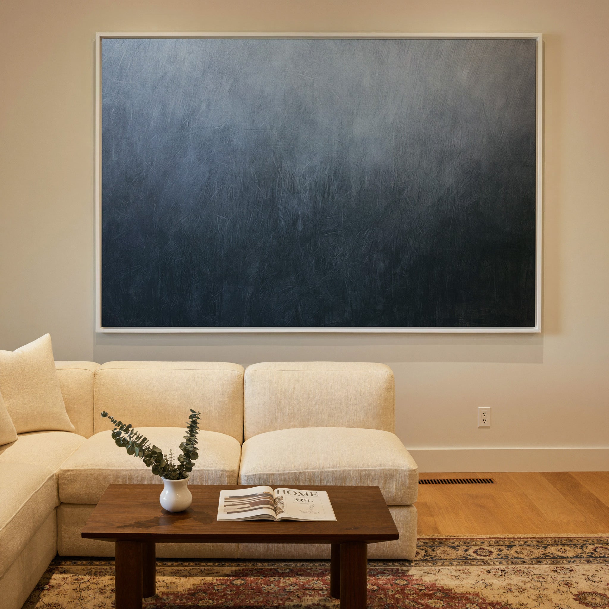cool blue gray abstract with soft vertical canvas wall art in a white frame in a styled room setting
