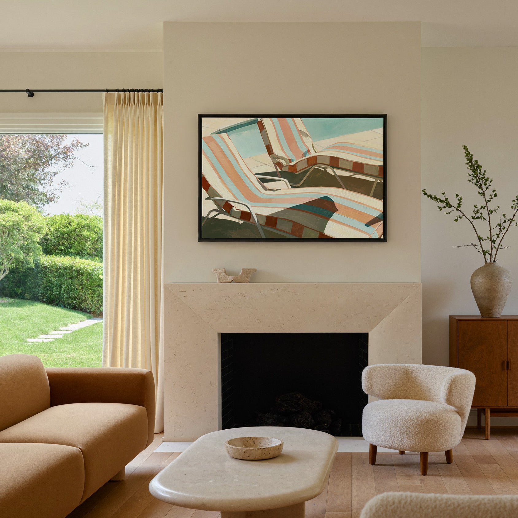 sun faded striped lounge chairs canvas wall art in a black frame above a mantel