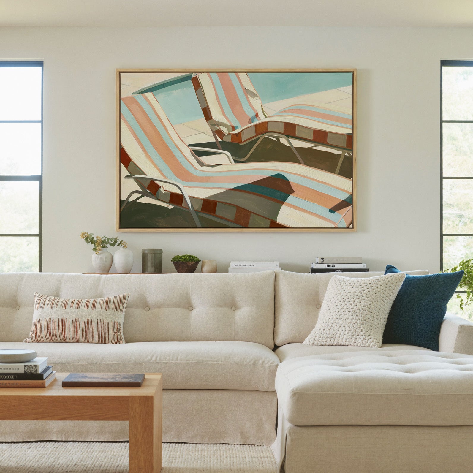 sun faded striped lounge chairs canvas wall art in a natural wood frame in a living room