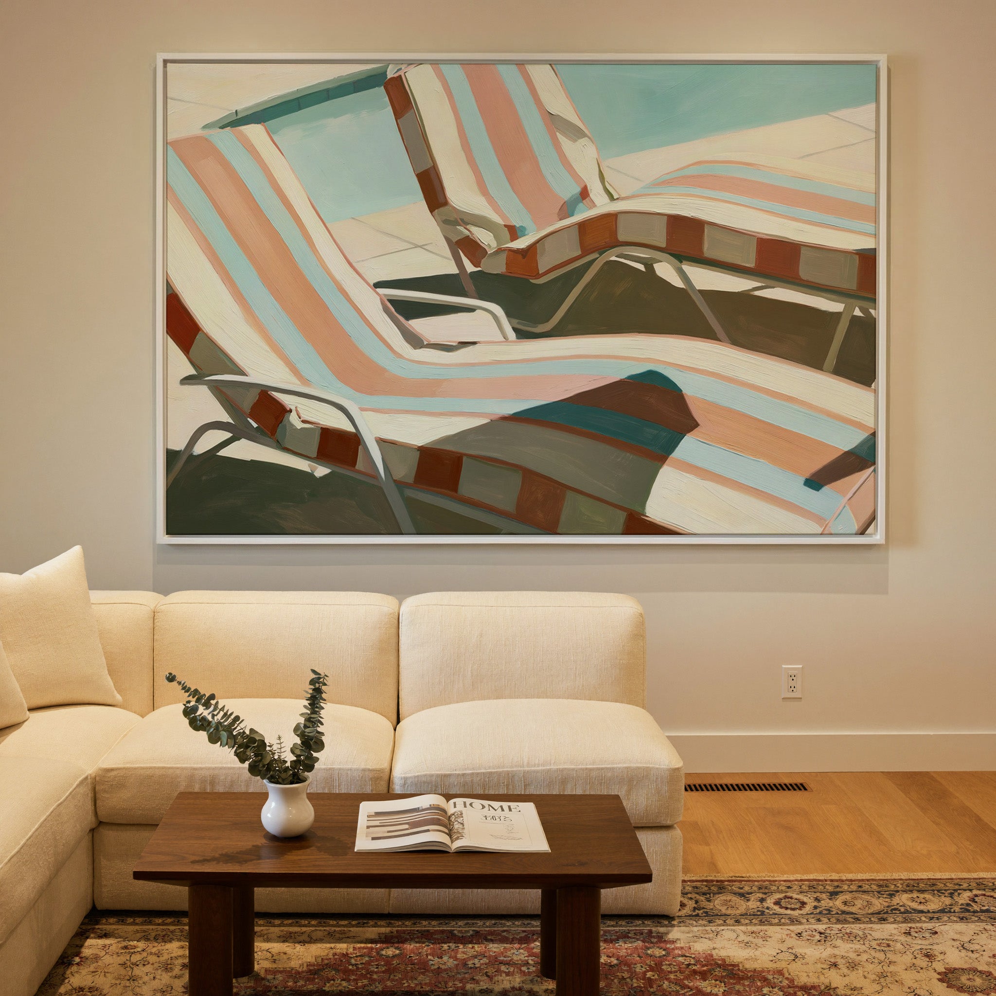sun faded striped lounge chairs canvas wall art in a white frame in a styled room setting