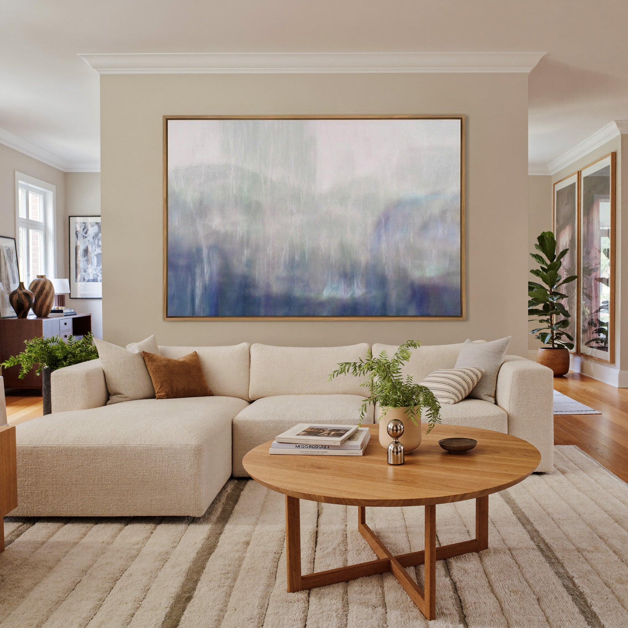 soft blue and violet abstract canvas wall art in an oak frame in a living room