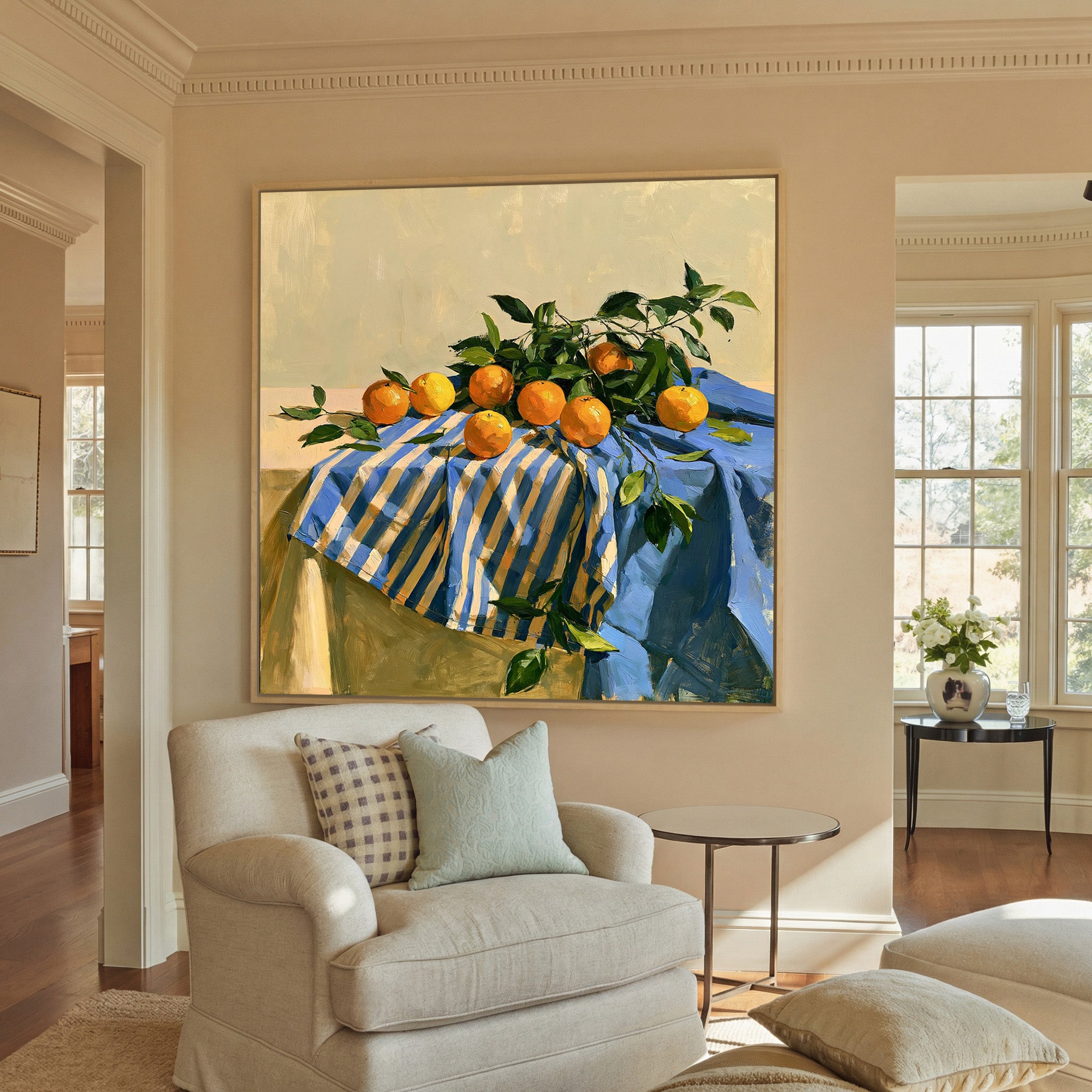 oranges on a blue striped cloth canvas wall art in a natural wood frame in a styled room setting