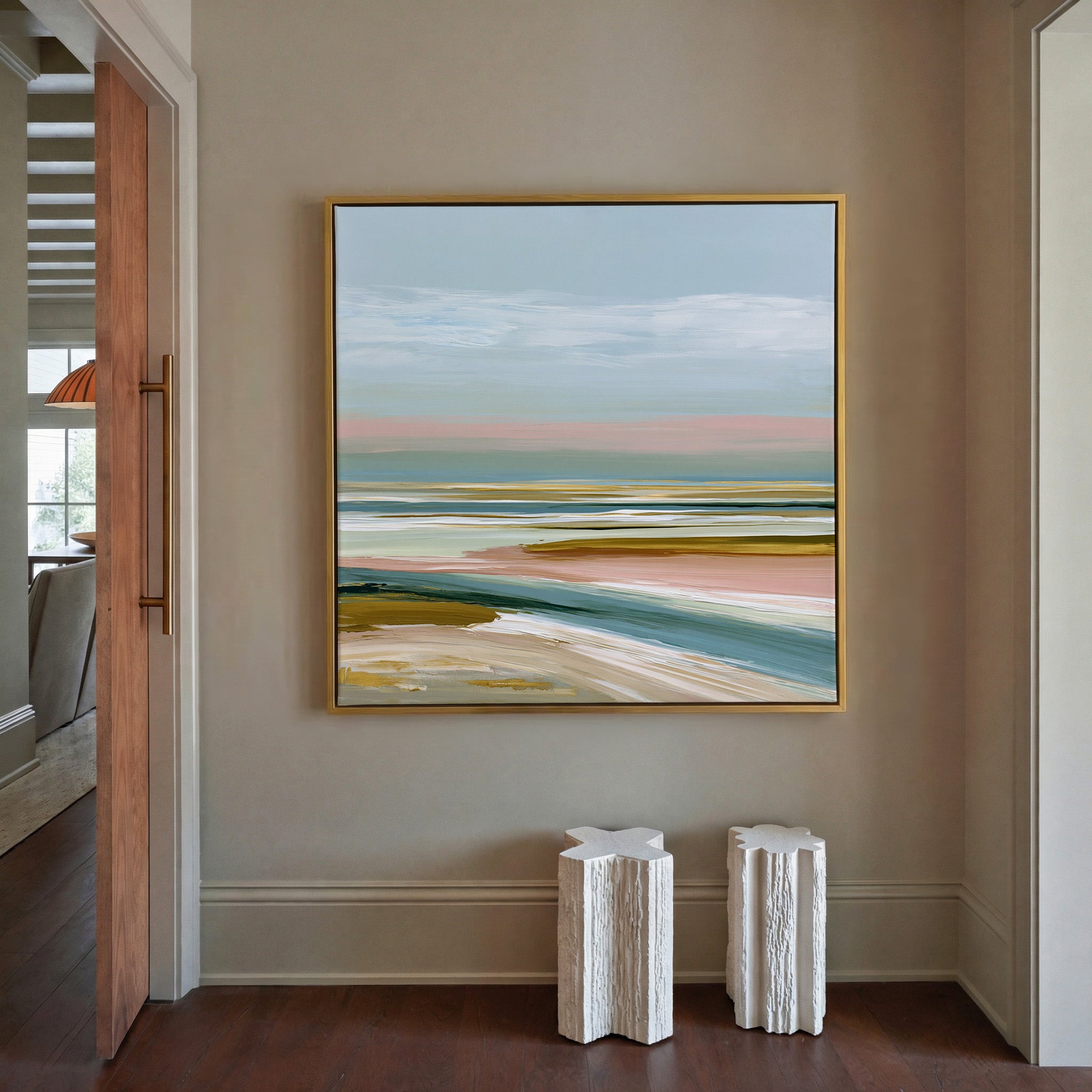 layered seafoam, blush, and sand bands canvas wall art in a gold frame in a styled room setting