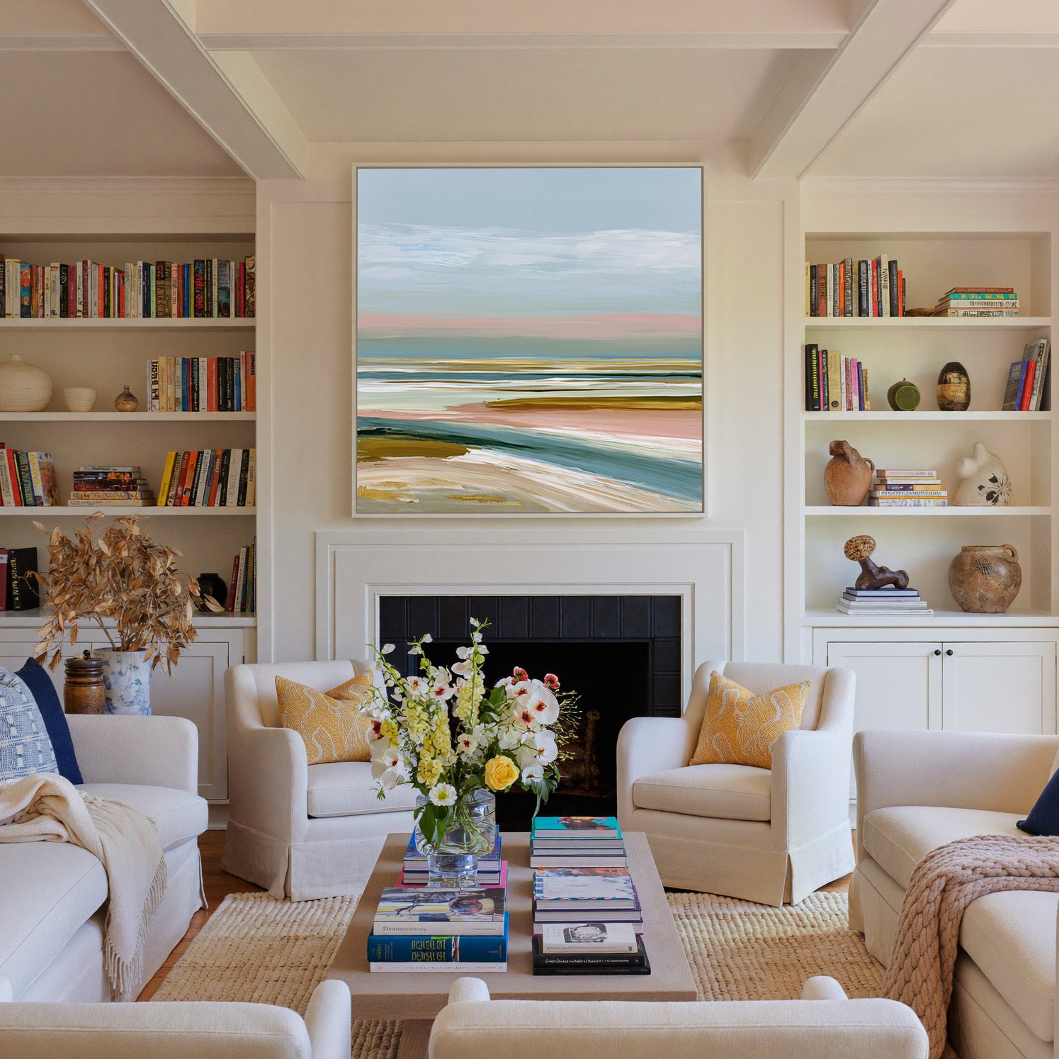 layered seafoam, blush, and sand bands canvas wall art in a white frame above a fireplace