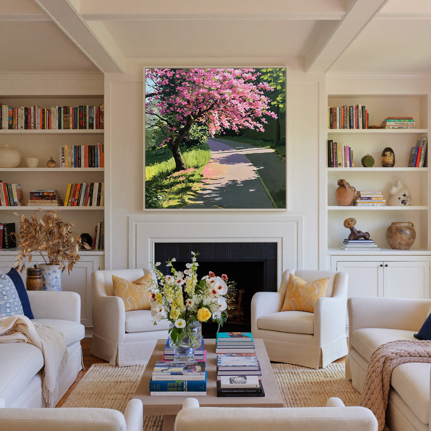 pink flowering tree beside a curving path canvas wall art in a white frame above a fireplace