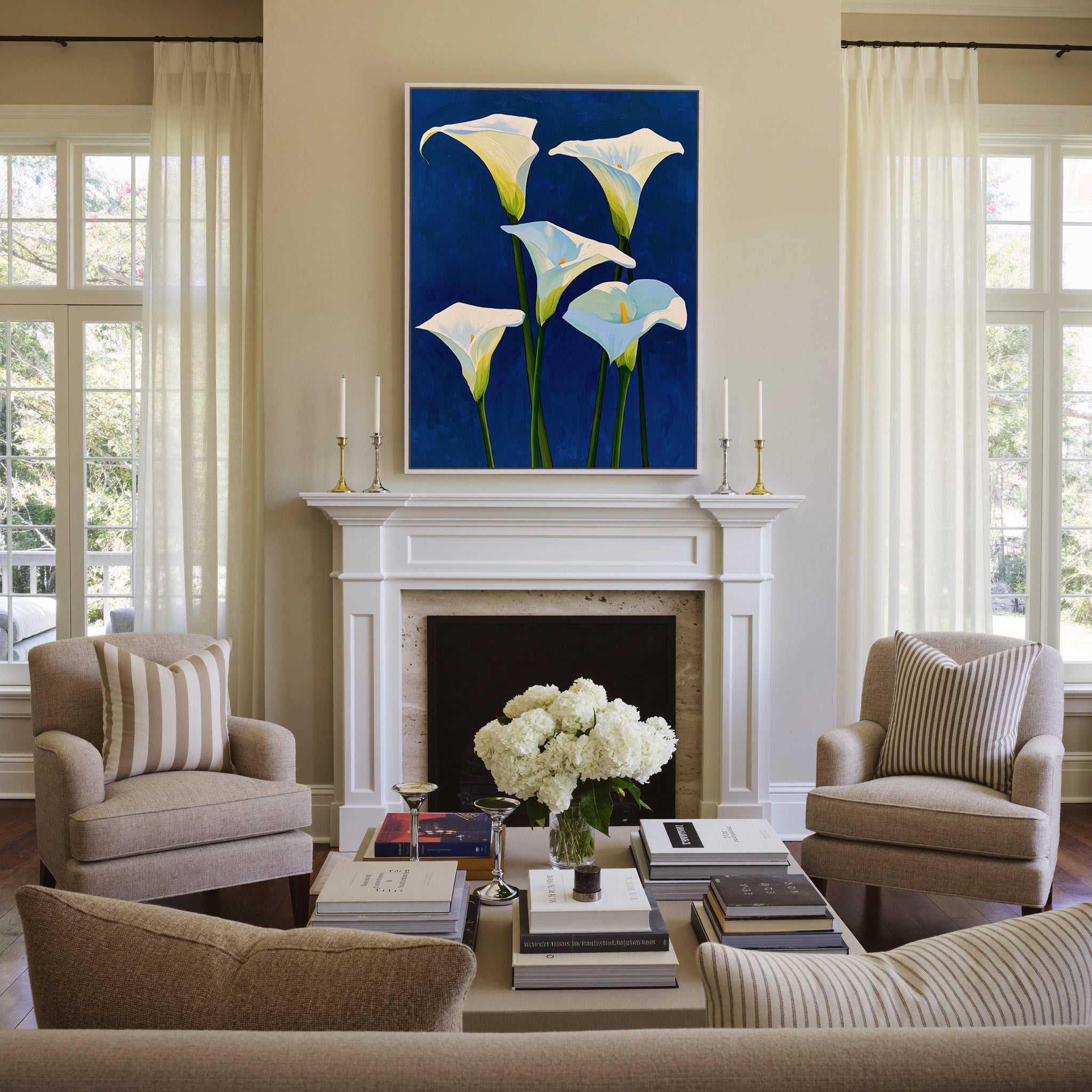 white calla lilies on deep cobalt blue canvas wall art in a white frame above a mantel