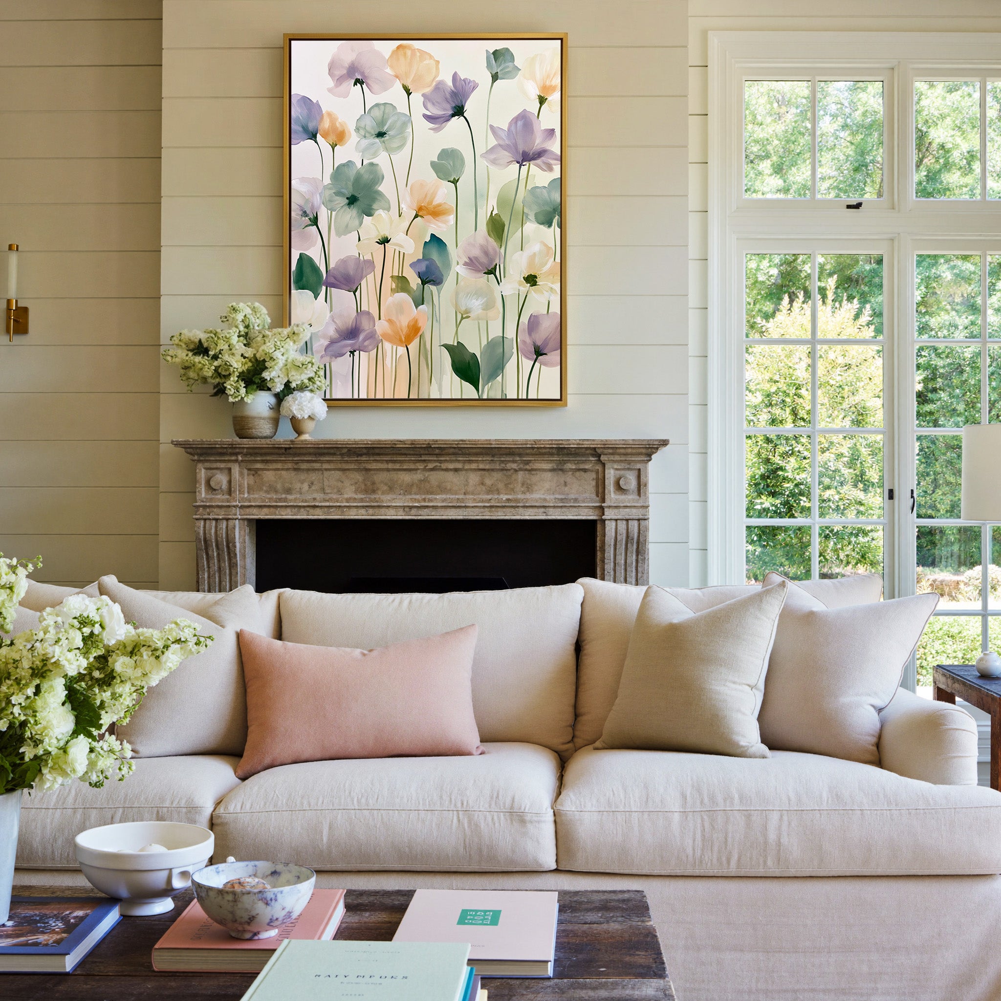soft lavender, sage, peach, and cream floral canvas wall art in a gold frame above a mantel