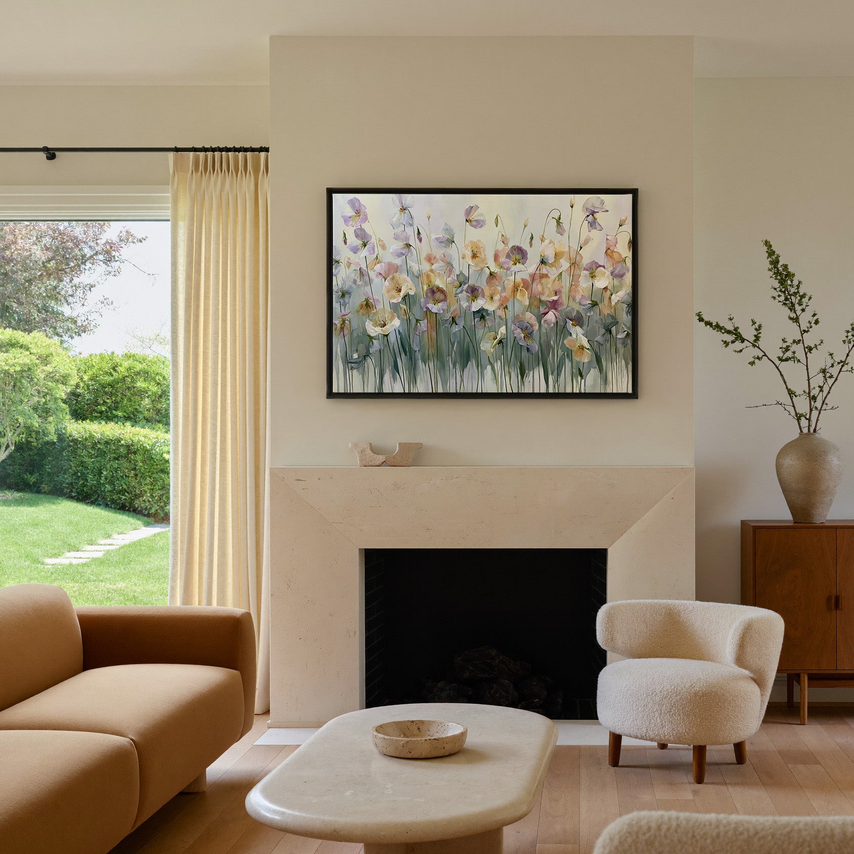 soft lavender, sage, peach, and cream floral canvas wall art in a black frame above a mantel