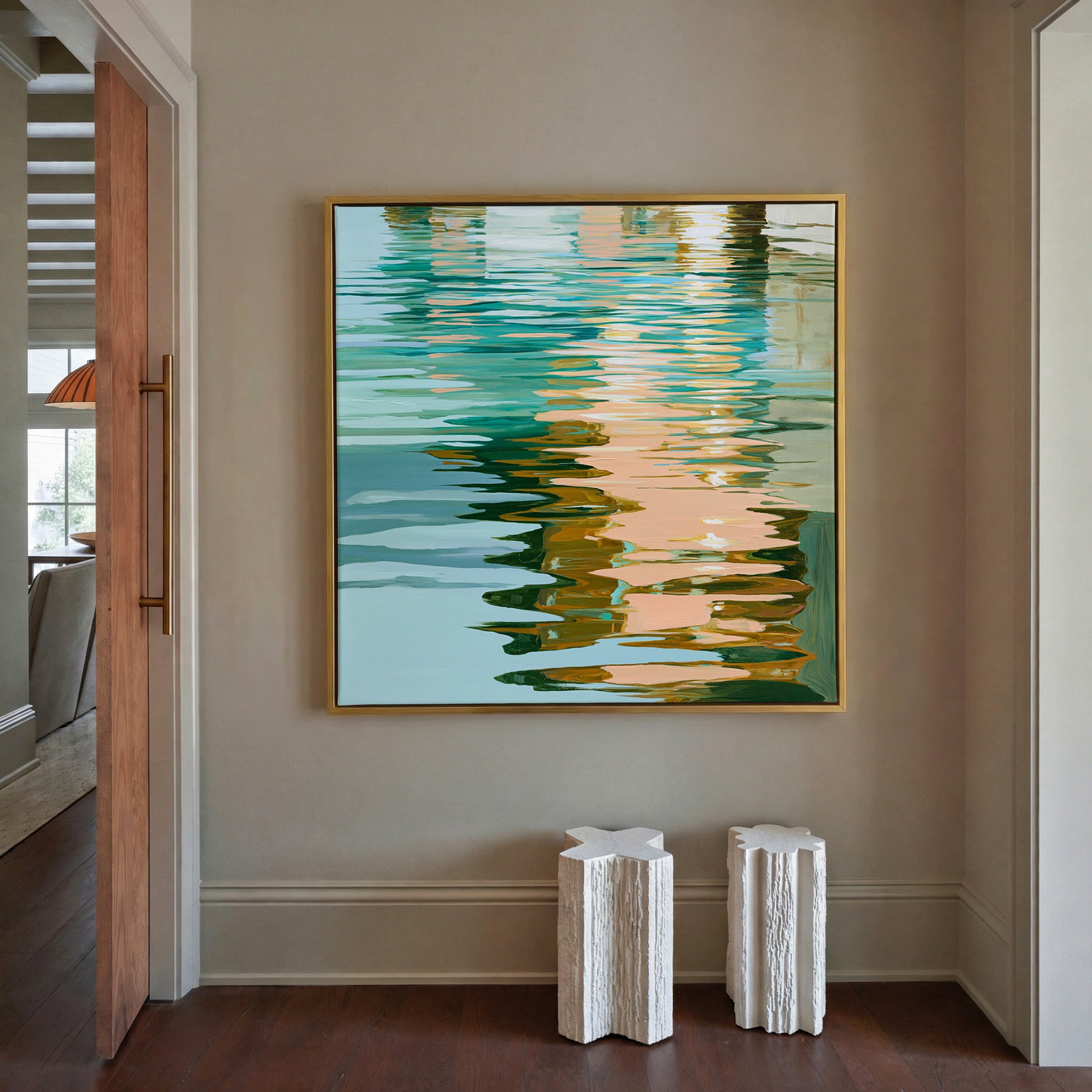 turquoise, peach, and olive abstract with canvas wall art in a gold frame in a styled room setting